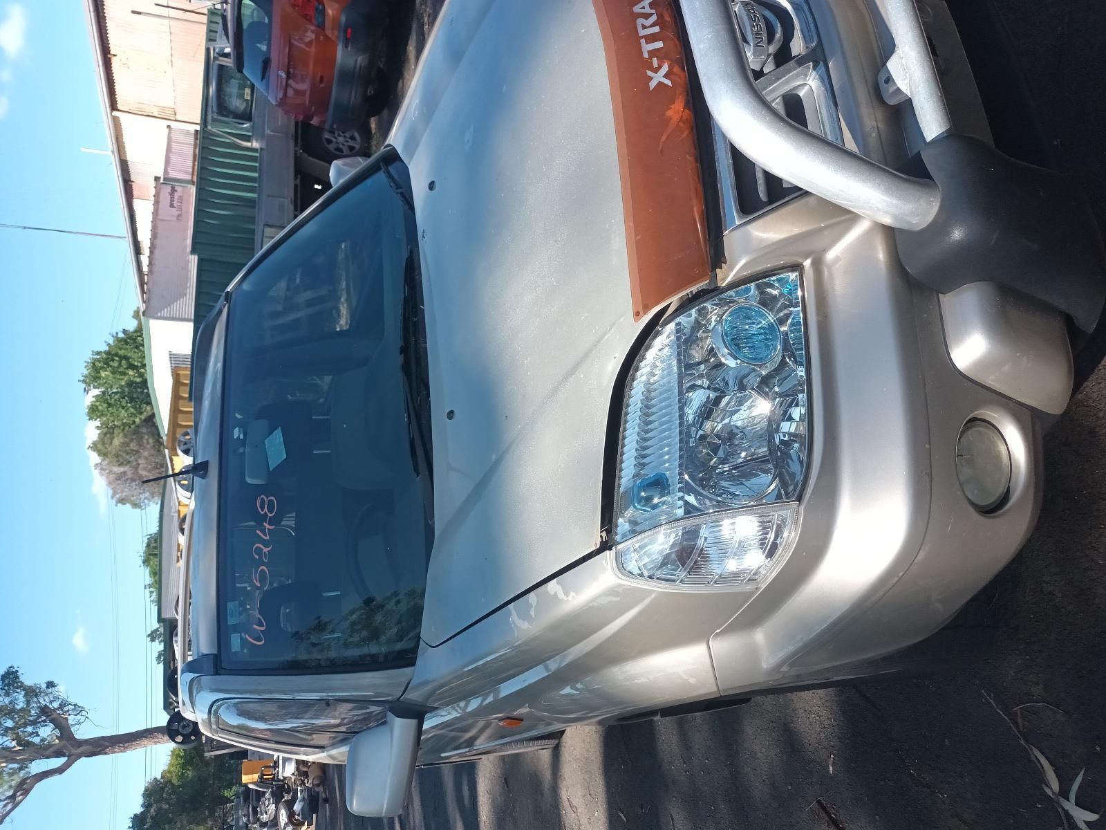 A Silver Nissan X Trail is Parked on the Side of the Road — South West 4WD Wreckers in Harristown, QLD