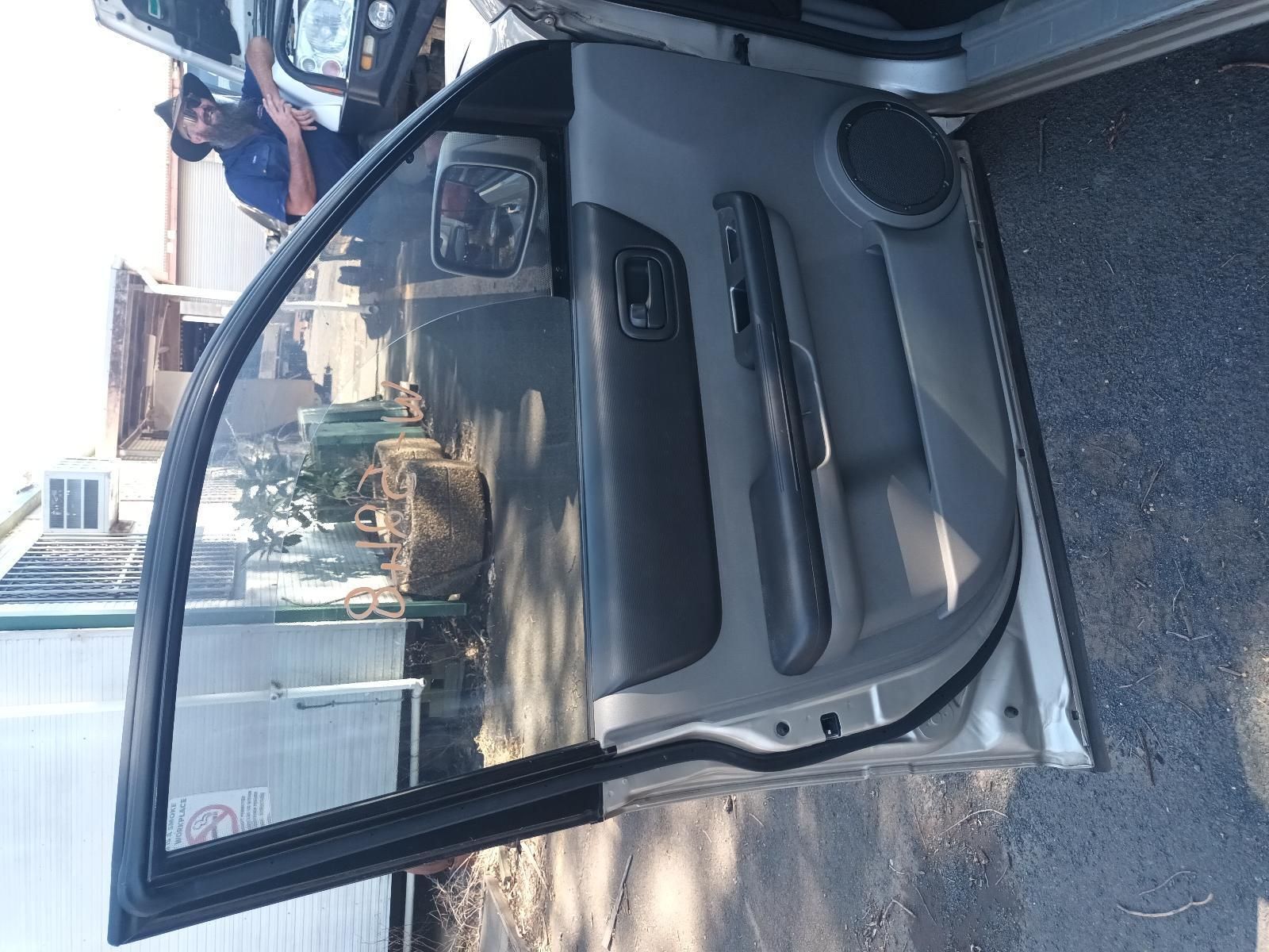 A Car with the Door Open is Parked on the Side of the Road — South West 4WD Wreckers in Harristown, QLD