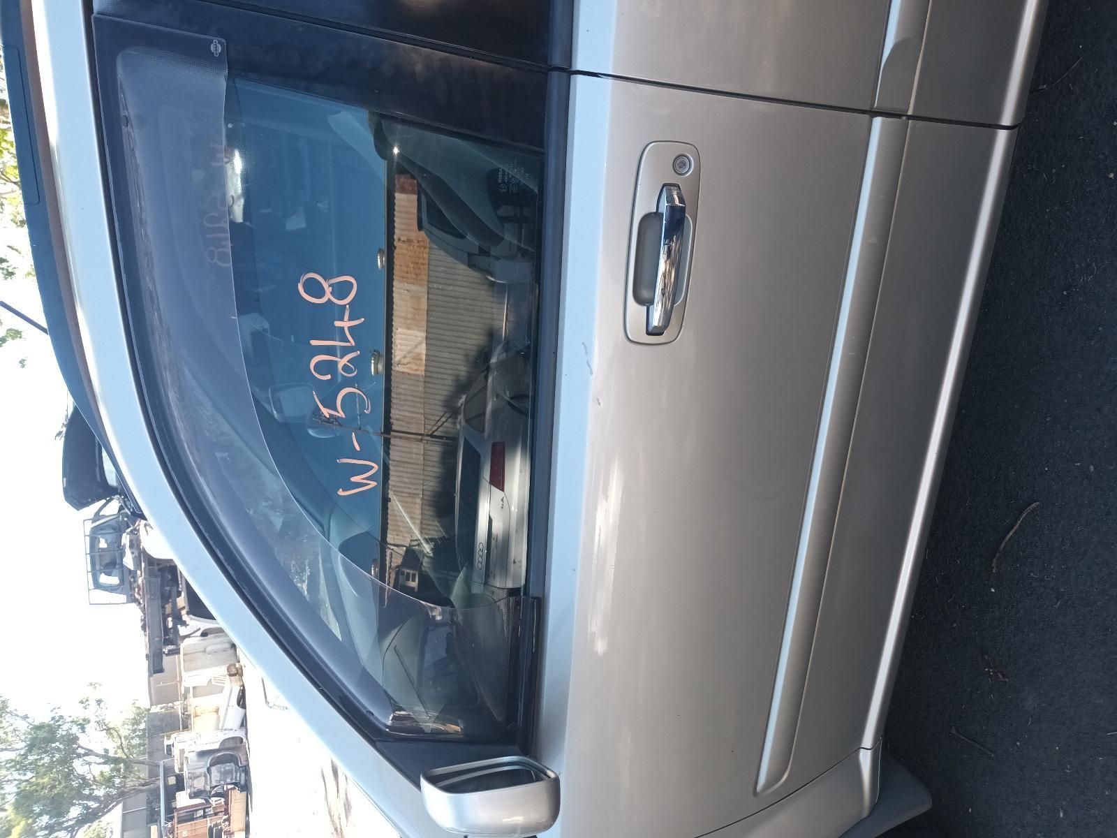 A Silver Car with the Numbers Written on the Door — South West 4WD Wreckers in Harristown, QLD
