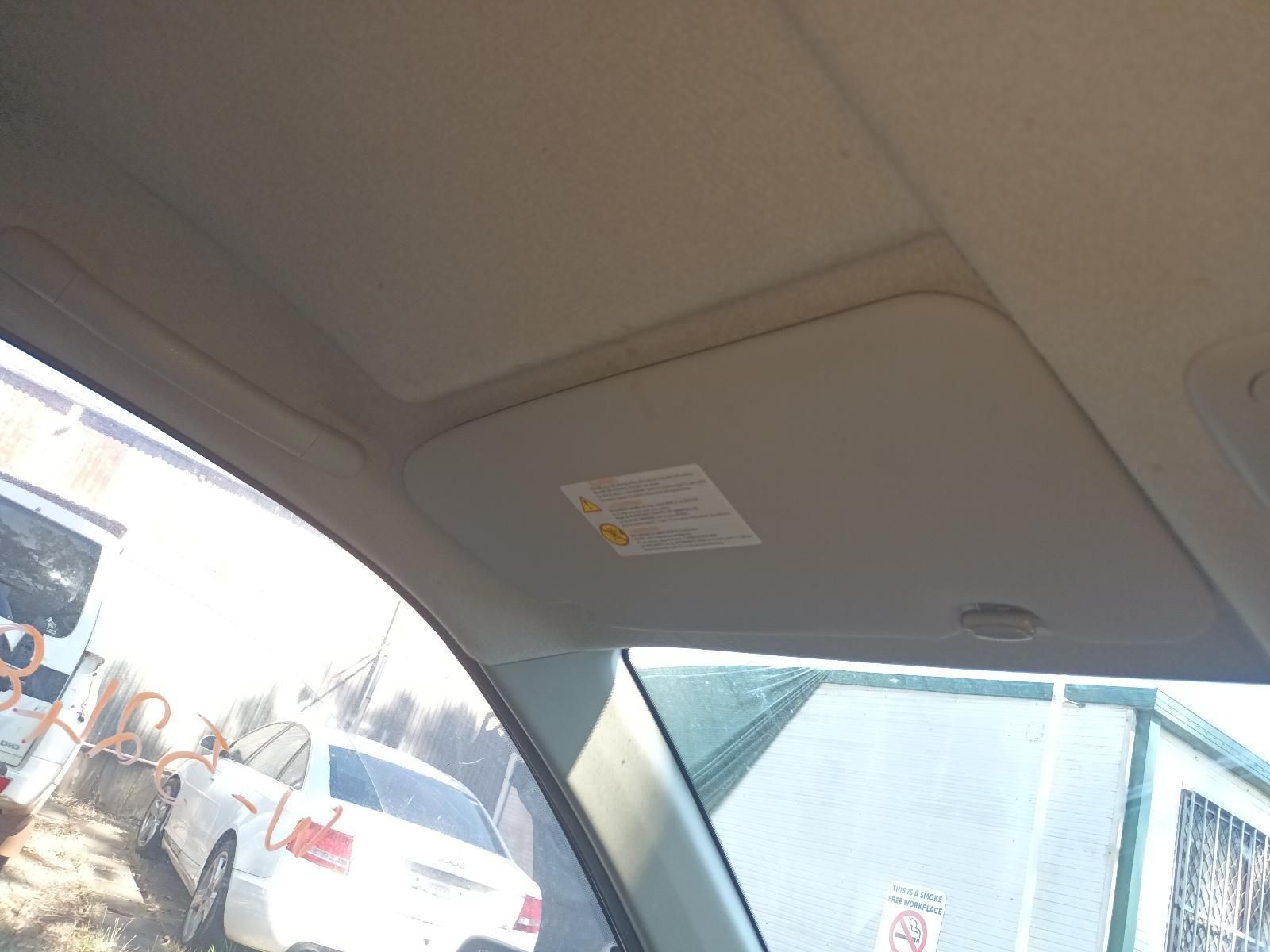 A Car with a Sun Visor on the Roof is Parked in a Parking Lot — South West 4WD Wreckers in Harristown, QLD
