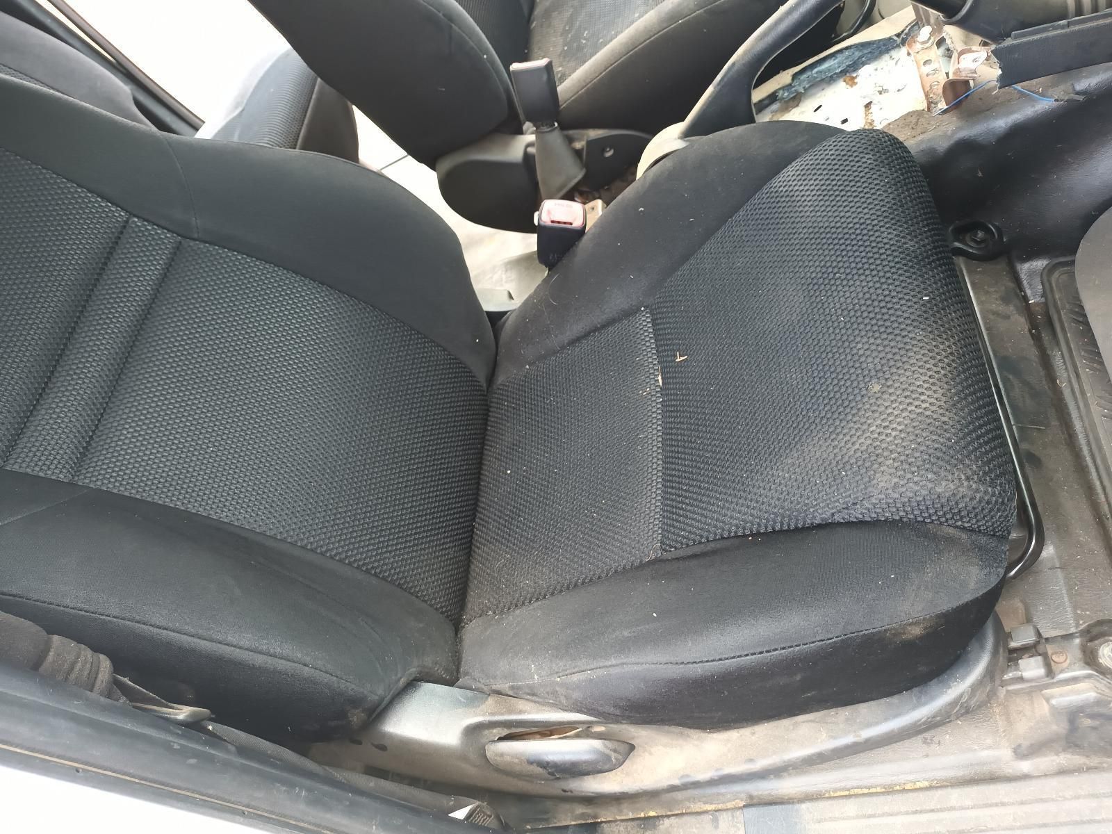 A Pair of Black Seats in a White Car — South West 4WD Wreckers In Brisbane, QLD