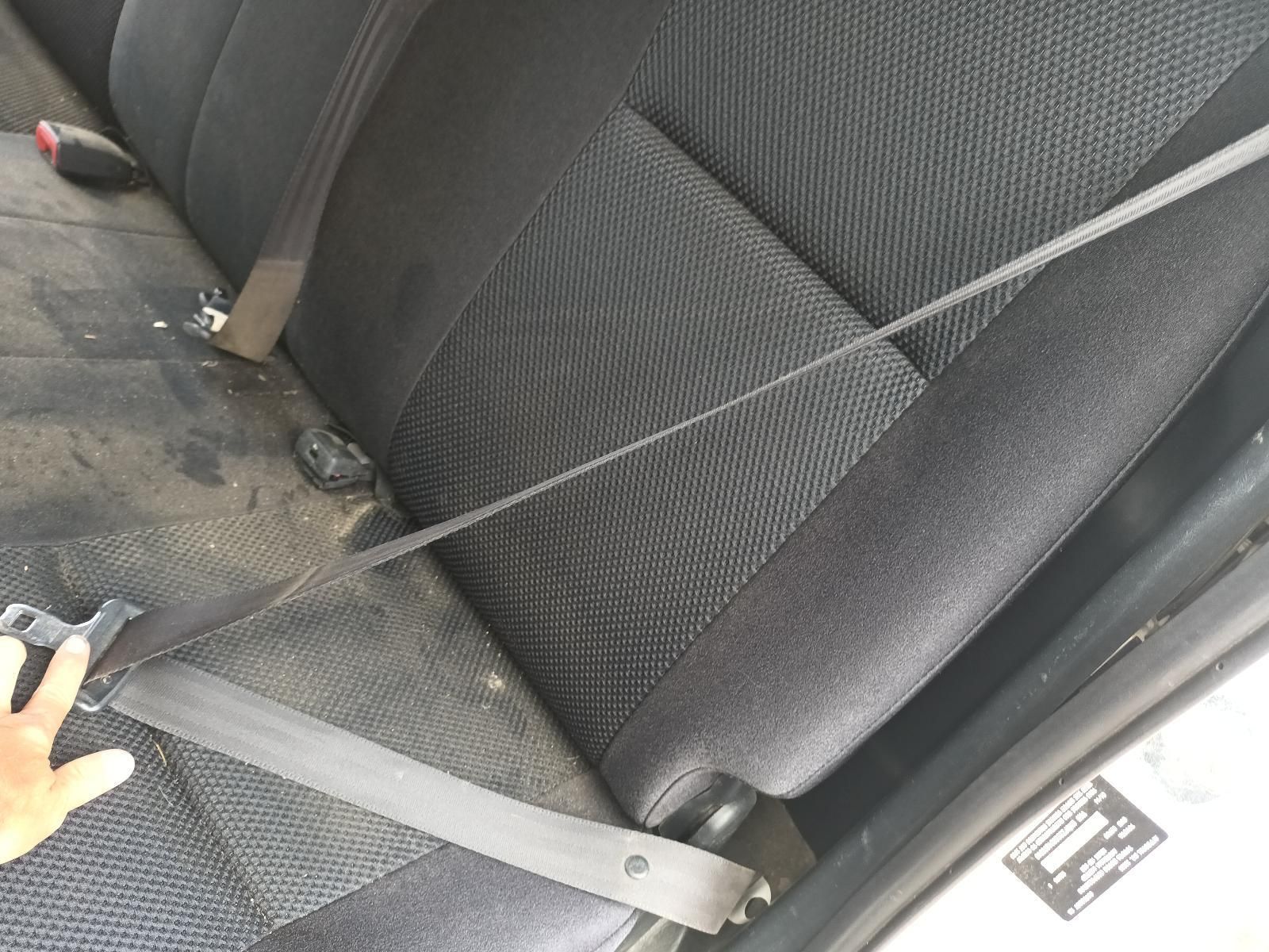 A Person is Holding a Seat Belt in a Car — South West 4WD Wreckers In Brisbane, QLD