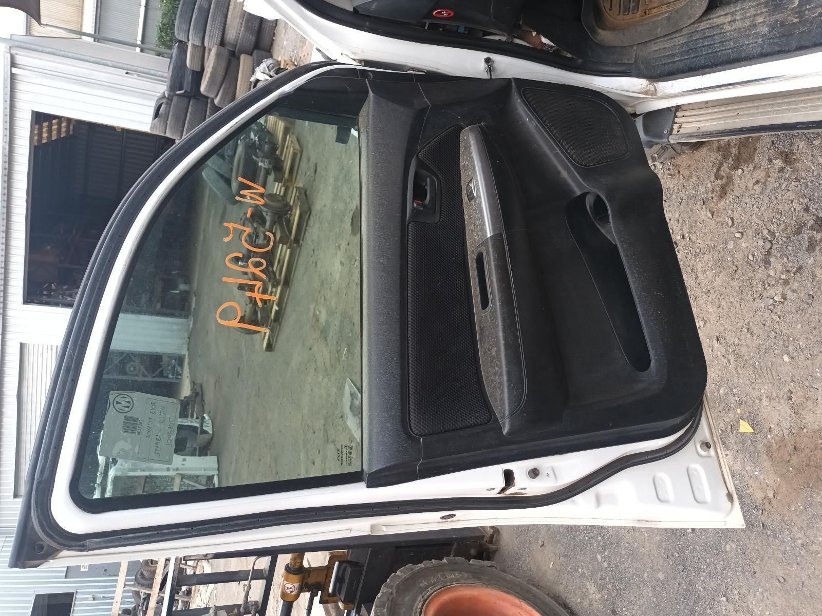 A White Car with the Door Open is Sitting on the Ground — South West 4WD Wreckers In Brisbane, QLD