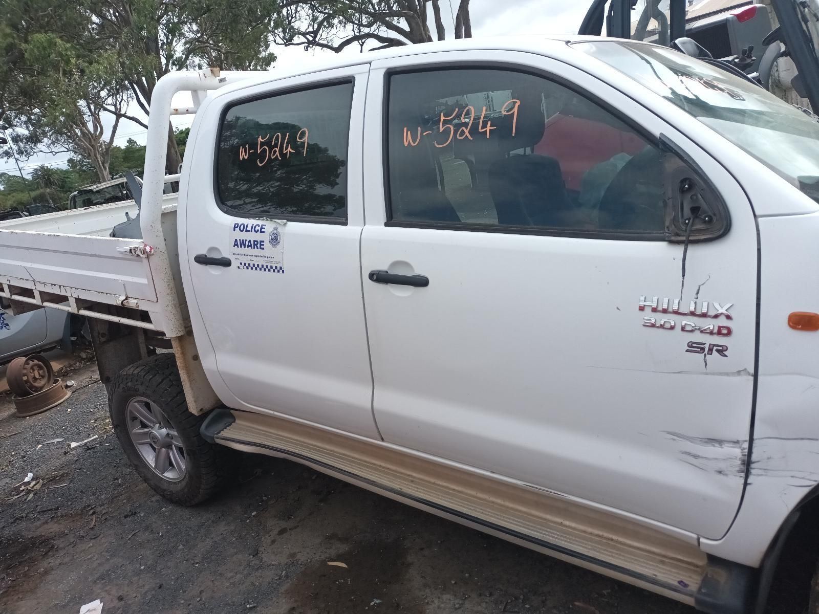 A White Truck is Parked on the Side of the Road — South West 4WD Wreckers In Brisbane, QLD