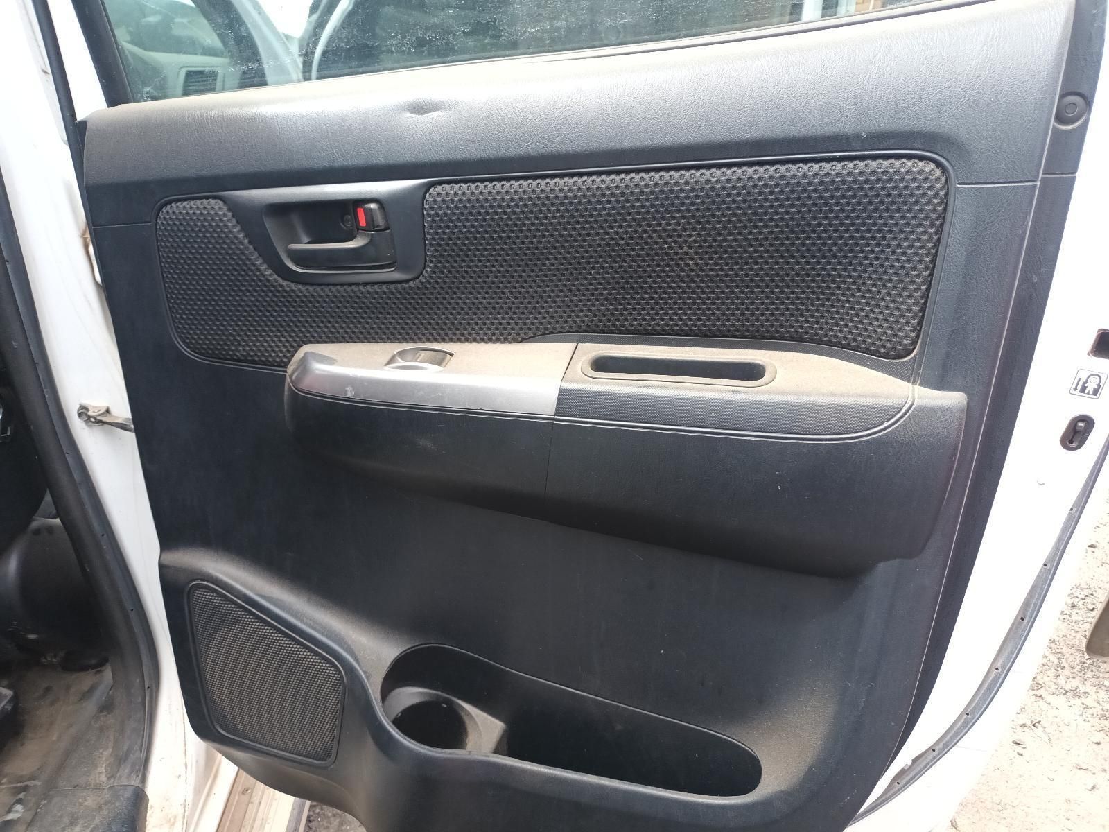 A White Car with a Black Door Handle and a Cup Holder — South West 4WD Wreckers In Brisbane, QLD