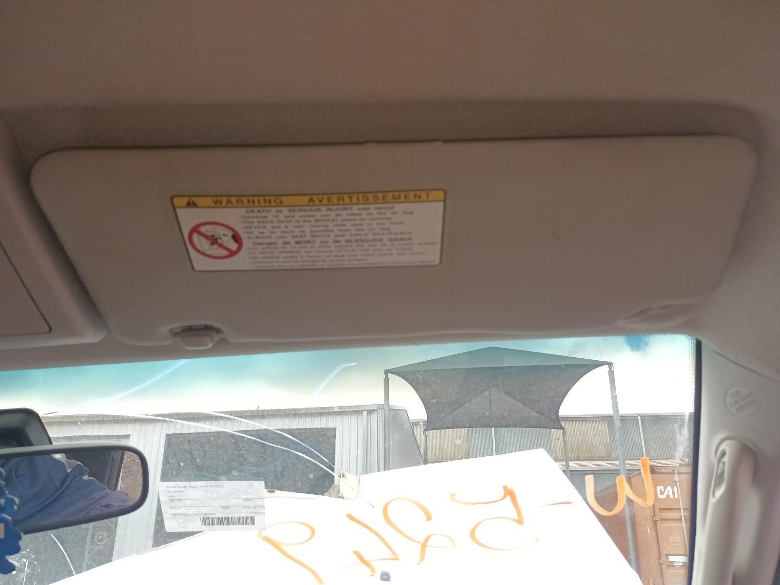 A Car Sun Visor with a Warning Label on It — South West 4WD Wreckers In Brisbane, QLD