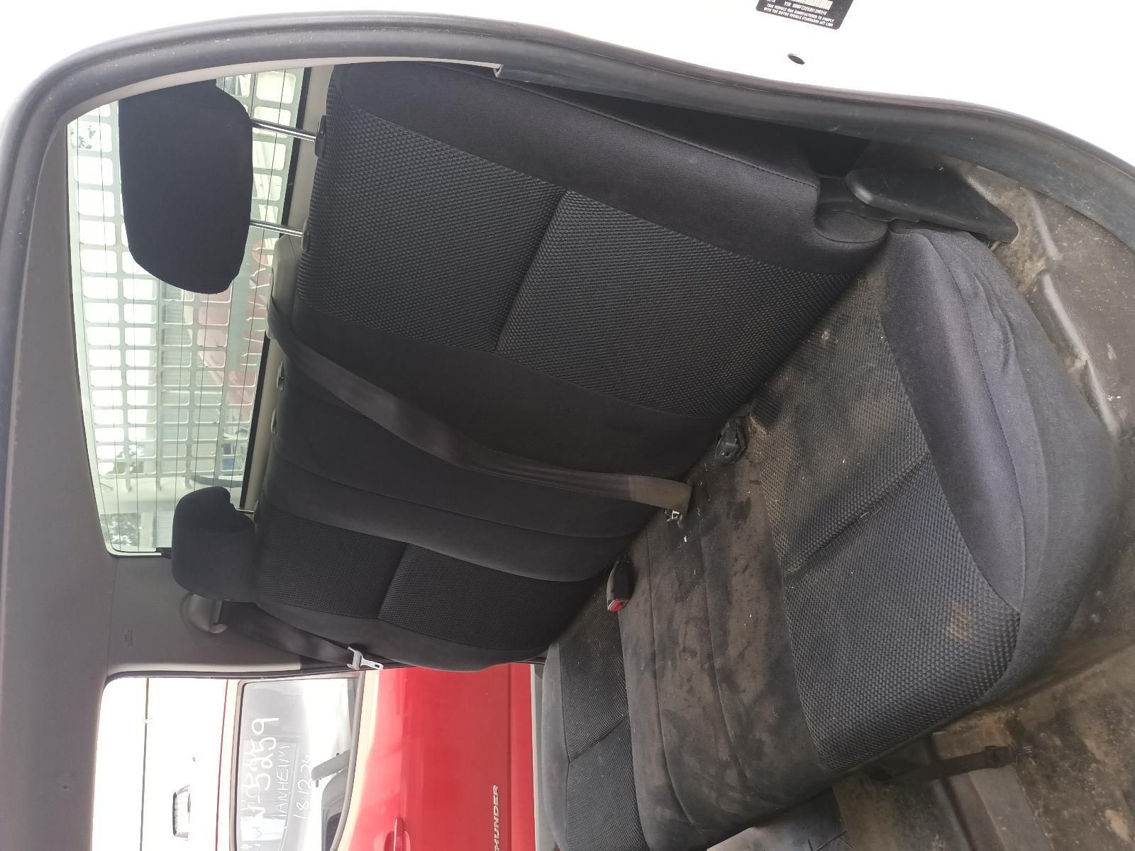 The Back Seat of a Car with a Red Car in the Background — South West 4WD Wreckers In Brisbane, QLD