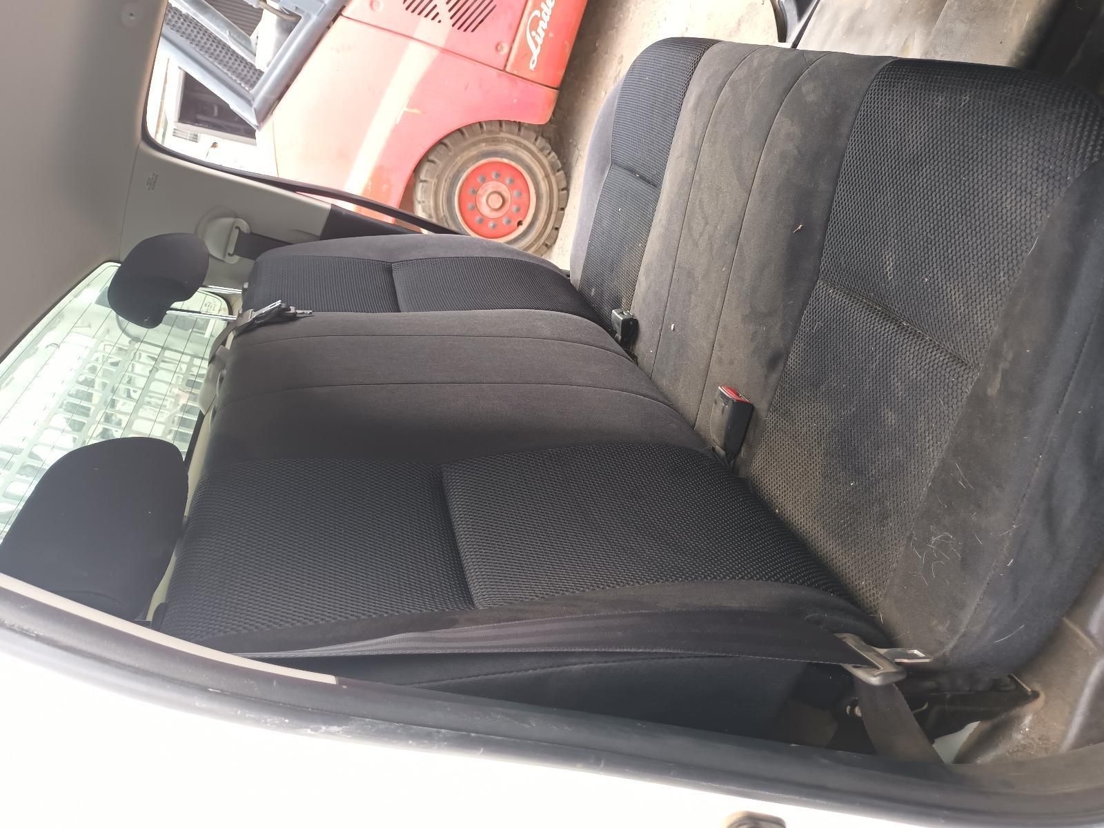 The Back Seat of a Car with a Forklift in the Background — South West 4WD Wreckers In Brisbane, QLD