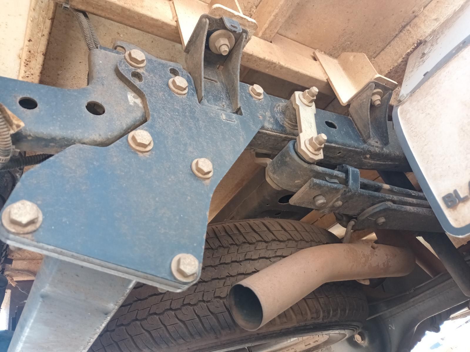 A Close Up of the Underside of a Truck with a Tire and Exhaust Pipe — South West 4WD Wreckers in Harristown, QLD
