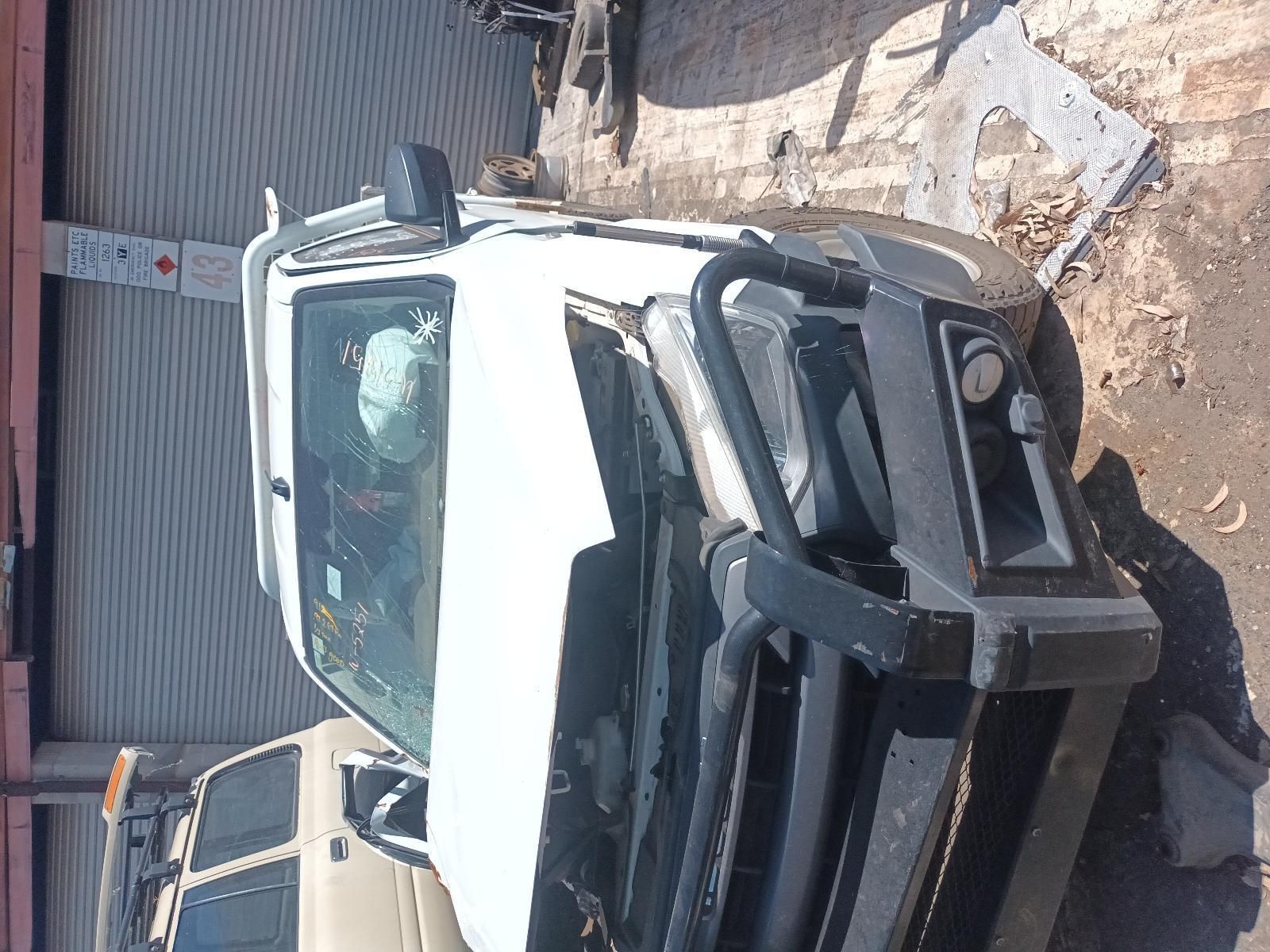 A White Truck is Parked on the Side of the Road — South West 4WD Wreckers in Harristown, QLD