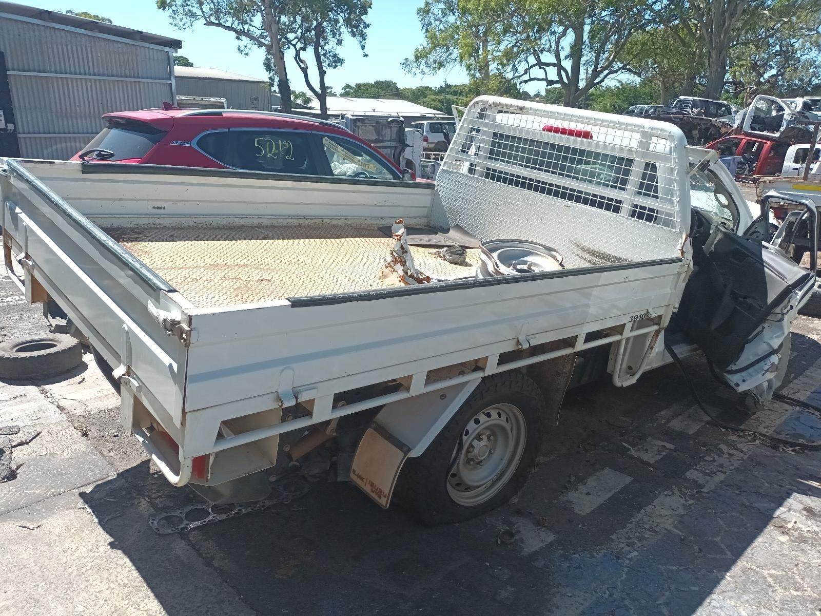 A White Truck is Sitting on the Side of the Road — South West 4WD Wreckers in Harristown, QLD