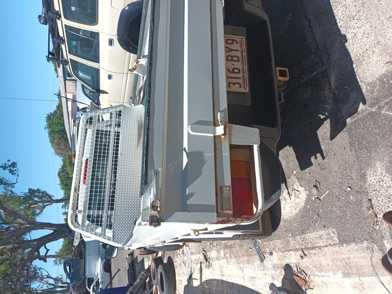 A White Truck with a License Plate — South West 4WD Wreckers in Harristown, QLD