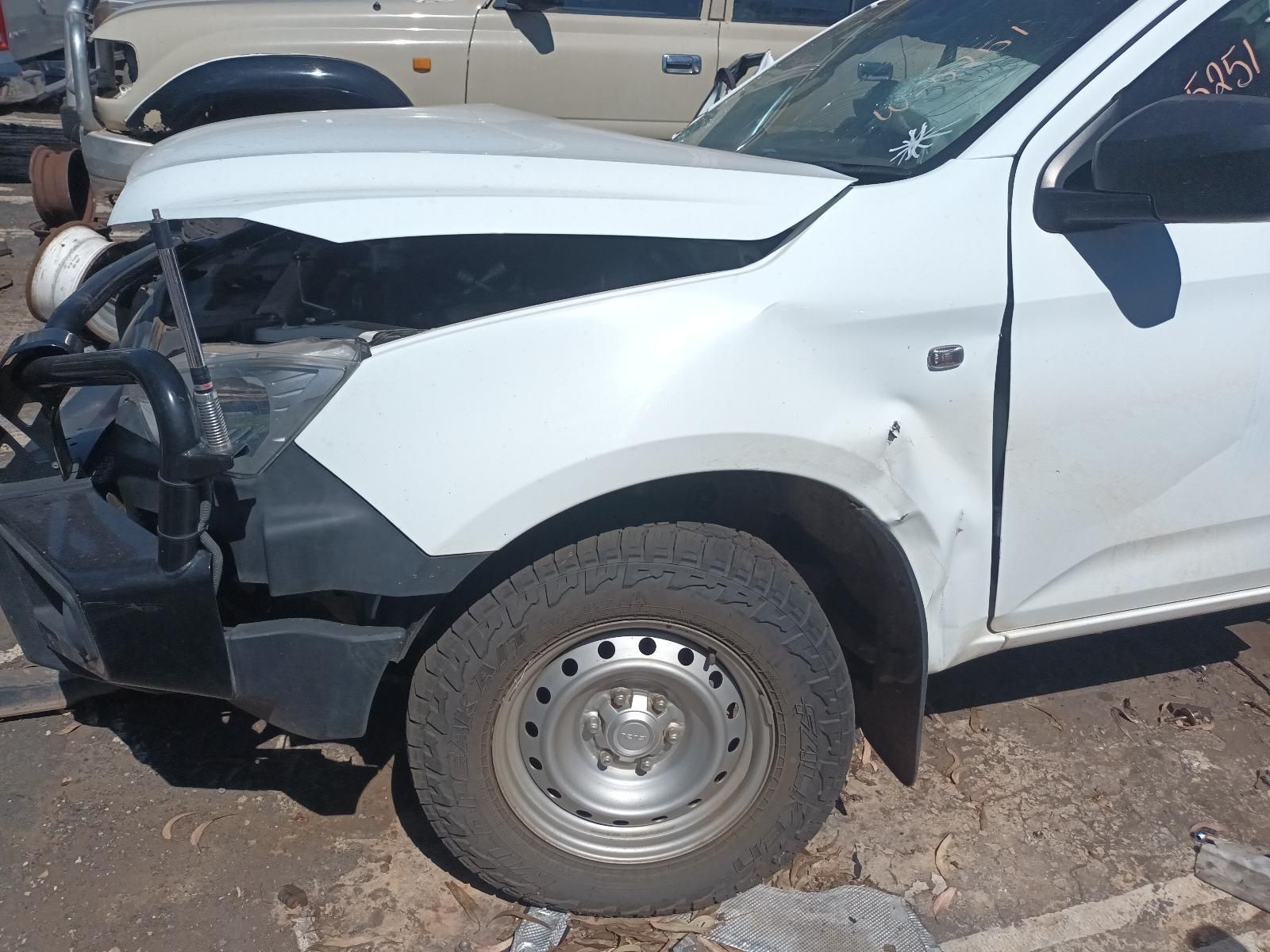A White Truck with a Damaged Hood is Parked on the Side of the Road — South West 4WD Wreckers in Harristown, QLD
