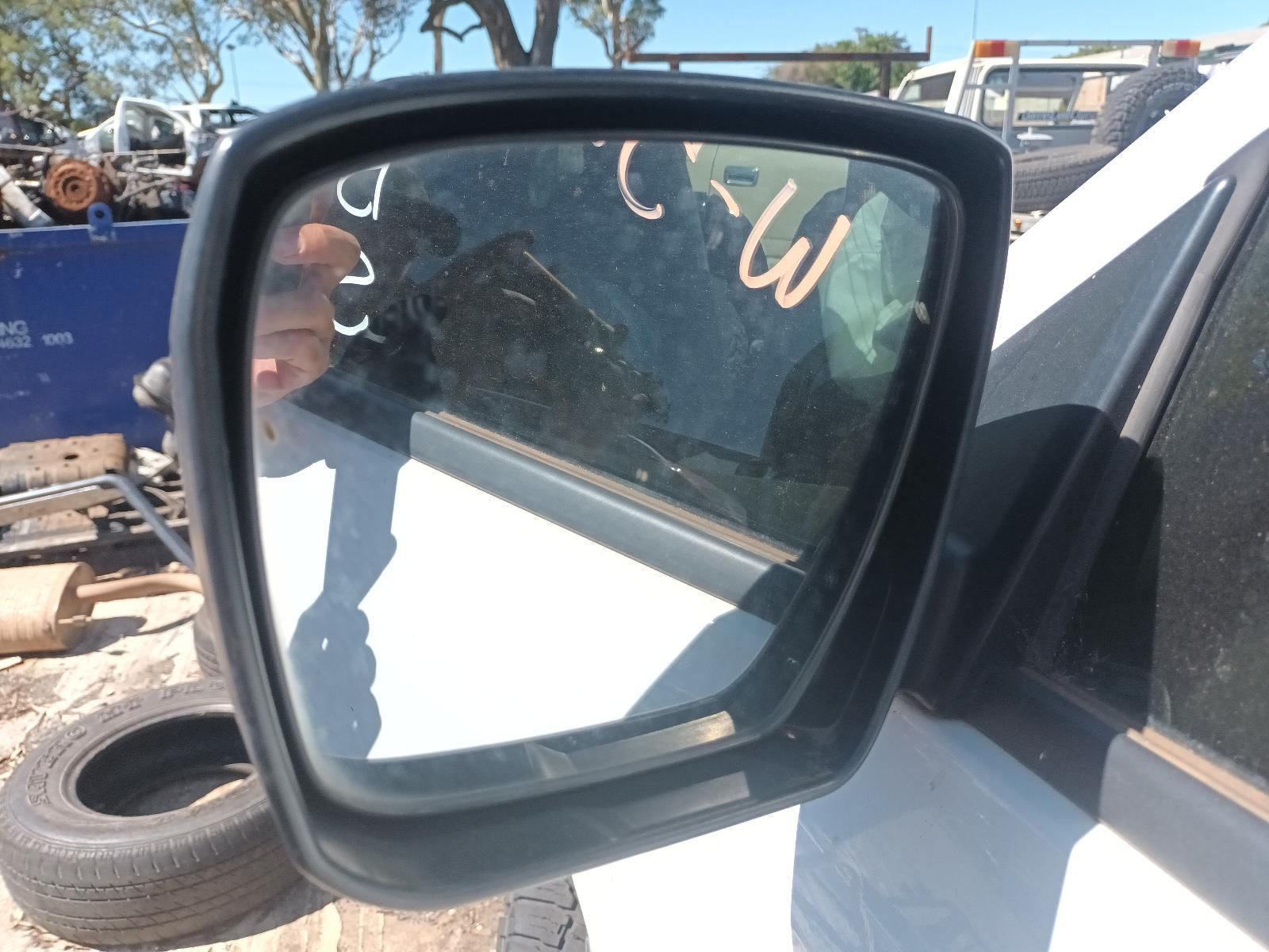 A Close Up of a Side View Mirror on a White Car — South West 4WD Wreckers in Harristown, QLD