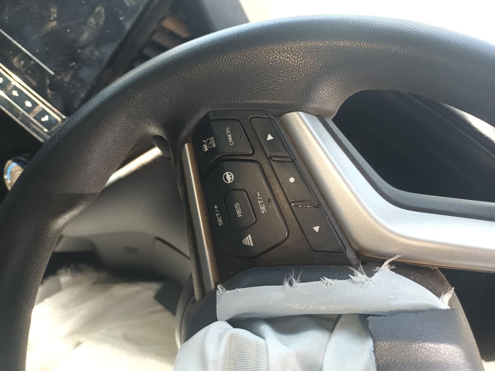 A Close Up of a Car Steering Wheel with Buttons on It — South West 4WD Wreckers in Harristown, QLD