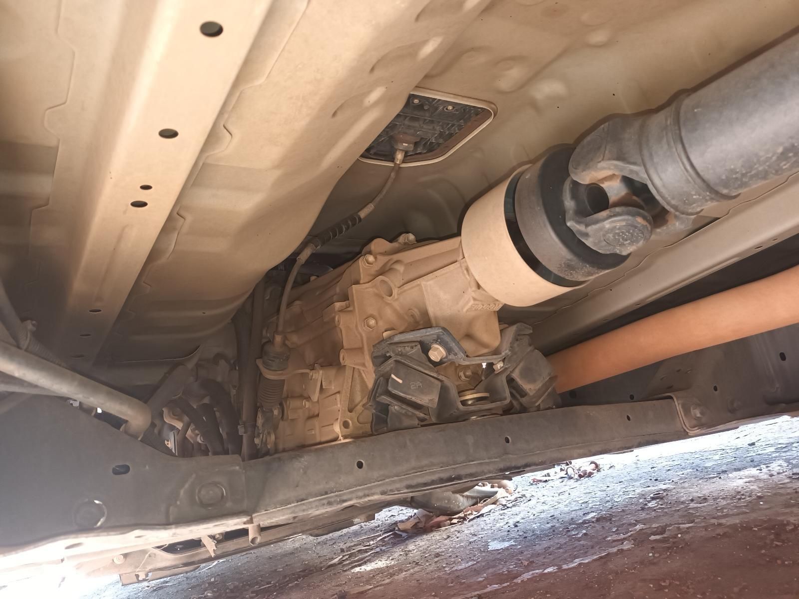 A Close Up of the Underside of a Car with a Hose Coming Out of It — South West 4WD Wreckers in Harristown, QLD