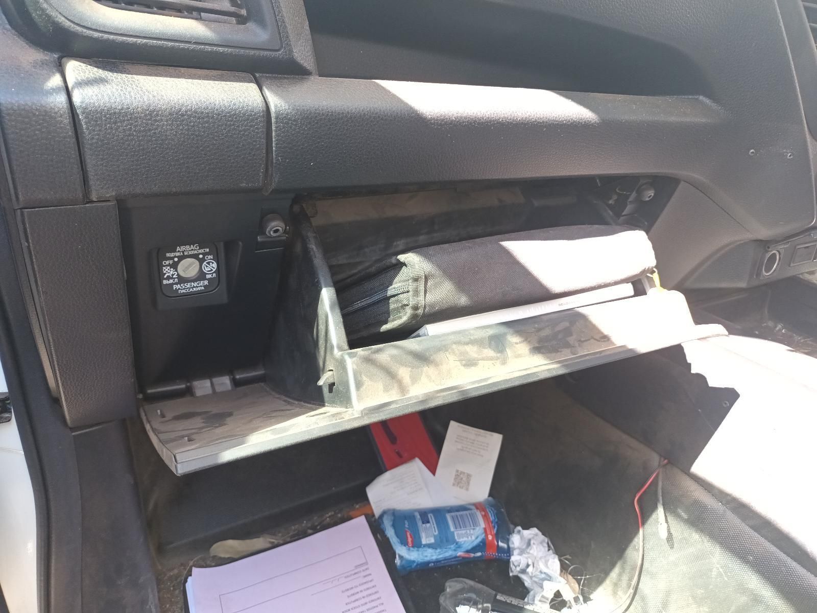 The Glove Box of a Car is Open and Filled with Papers and Keys — South West 4WD Wreckers in Harristown, QLD