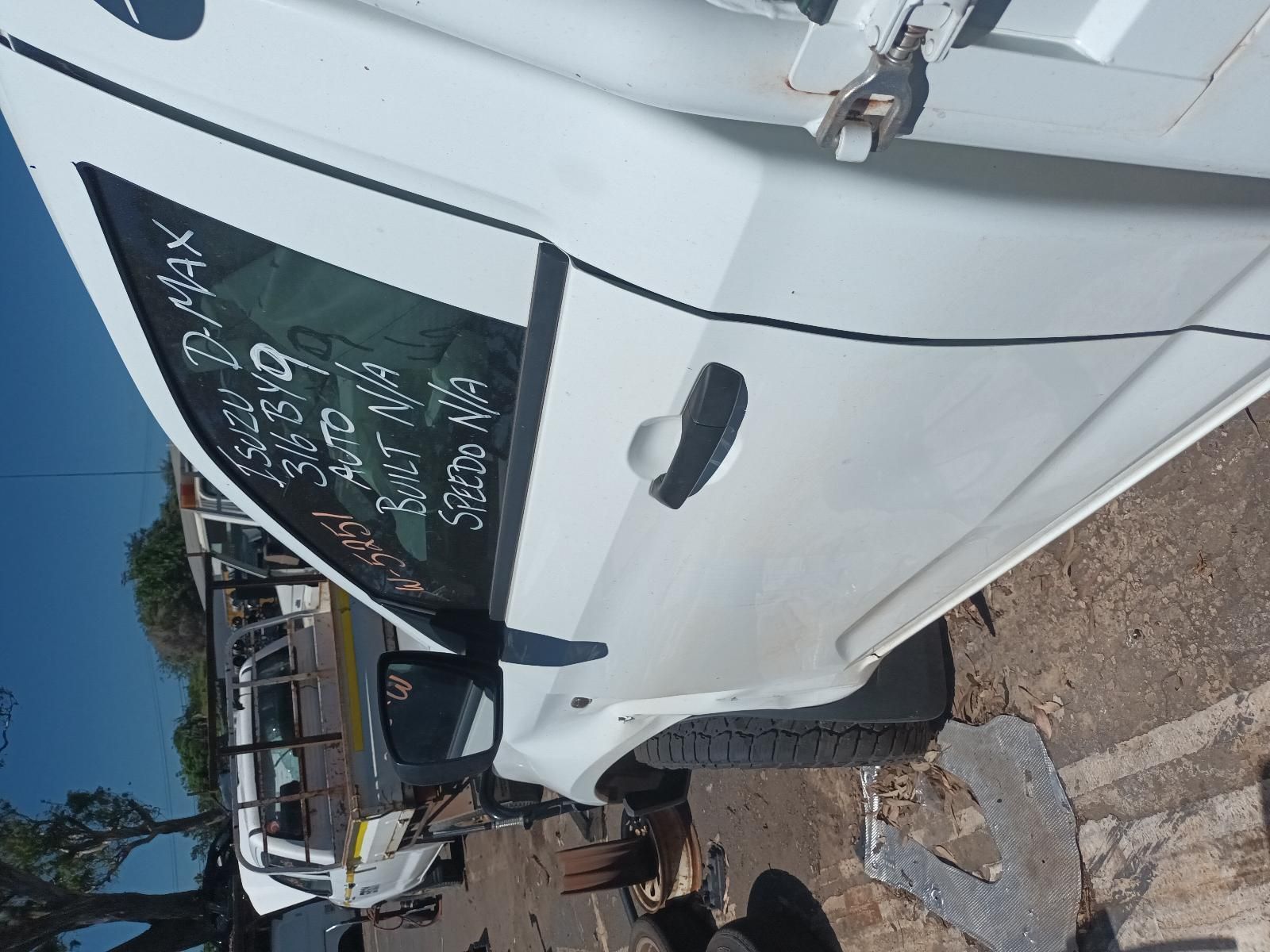 A White Car is Sitting on the Ground with the Door Open — South West 4WD Wreckers in Harristown, QLD