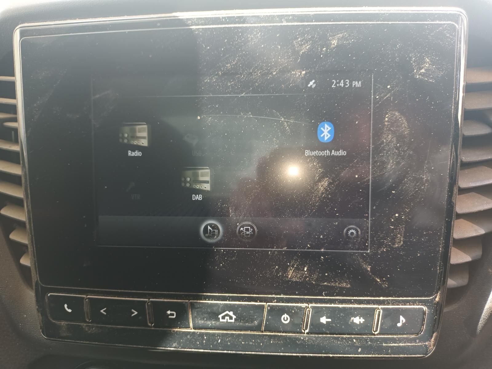 A Dirty Car Radio with a Bluetooth Icon on the Screen — South West 4WD Wreckers in Harristown, QLD