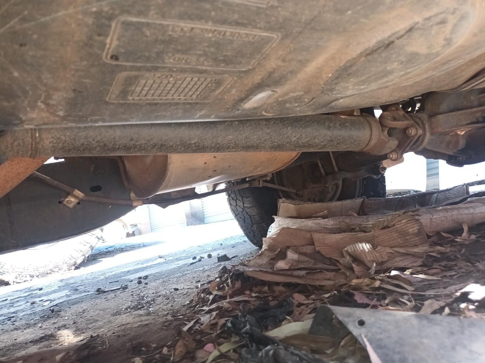 A Car is Parked on the Side of the Road and the Exhaust Pipe is Visible — South West 4WD Wreckers in Harristown, QLD