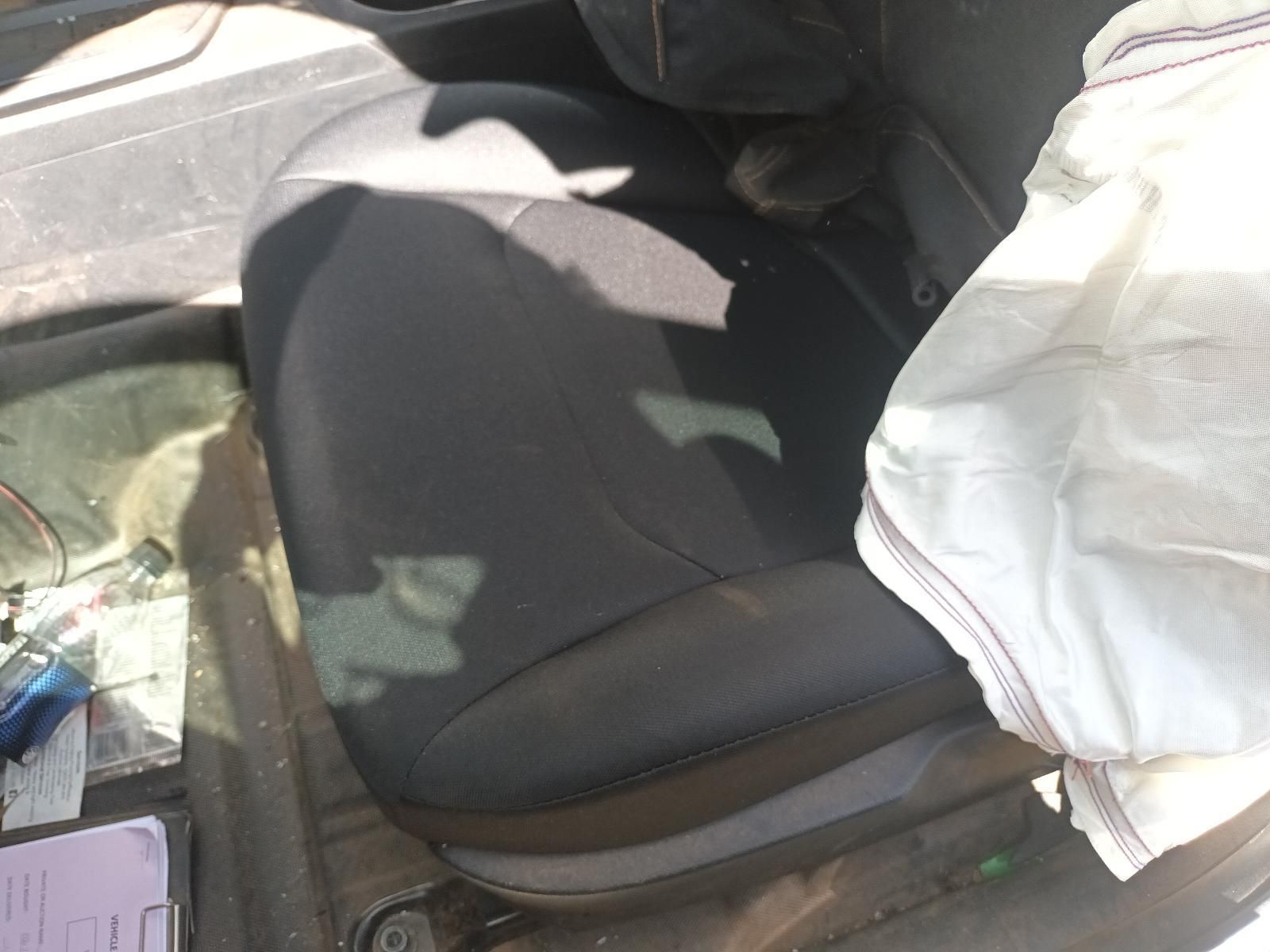A Black Car Seat with a White Bag on It — South West 4WD Wreckers in Harristown, QLD