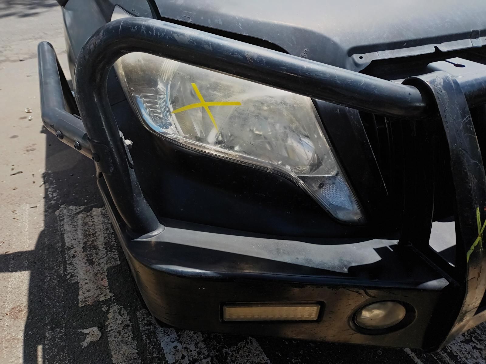 A Black Car with a Yellow Cross on the Headlight — South West 4WD Wreckers In Brisbane, QLD