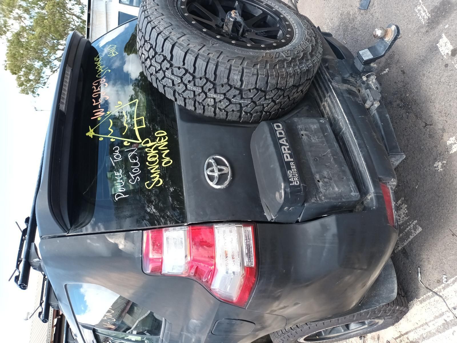 A Toyota Land Cruiser is Sitting on the Side of the Road — South West 4WD Wreckers In Brisbane, QLD