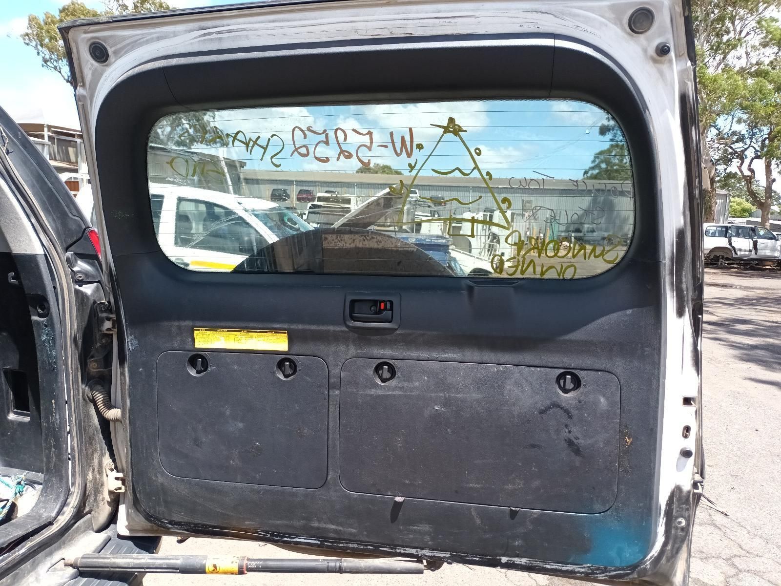 The Back of a White Car with the Rear Window Open — South West 4WD Wreckers In Brisbane, QLD