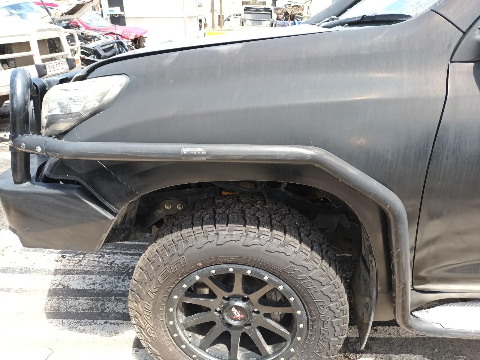 A Black Truck is Parked on the Side of the Road — South West 4WD Wreckers In Brisbane, QLD