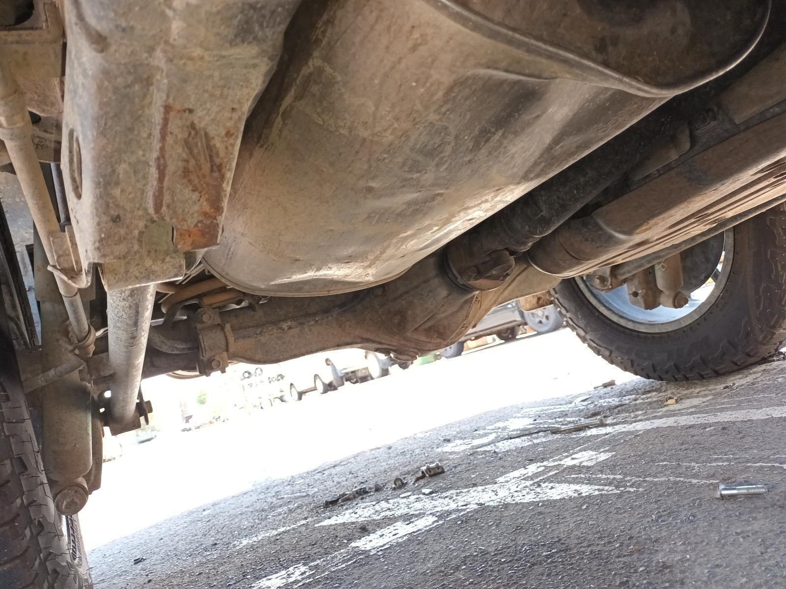 A Close Up of the Underside of a Car Parked on the Side of the Road — South West 4WD Wreckers In Brisbane, QLD