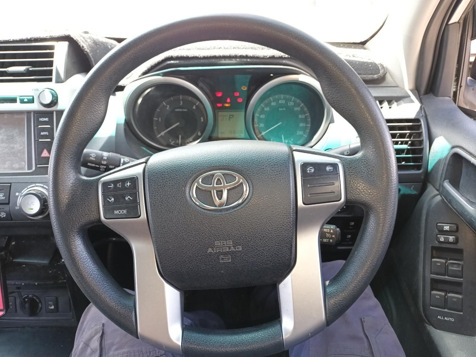 A Person is Sitting in the Driver's Seat of a Toyota Car — South West 4WD Wreckers In Brisbane, QLD