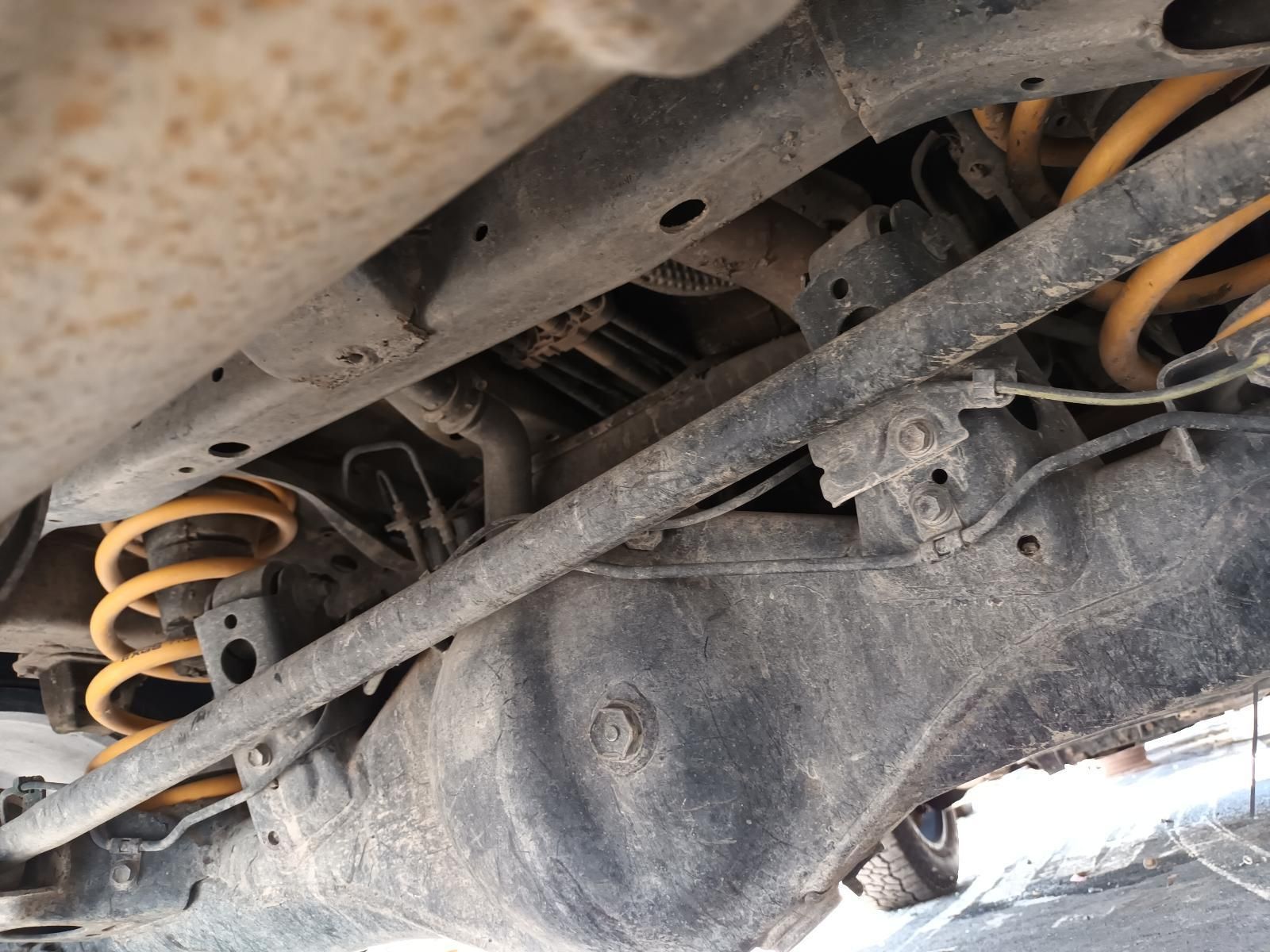 A Close Up of the Underside of a Car with Yellow Springs — South West 4WD Wreckers In Brisbane, QLD