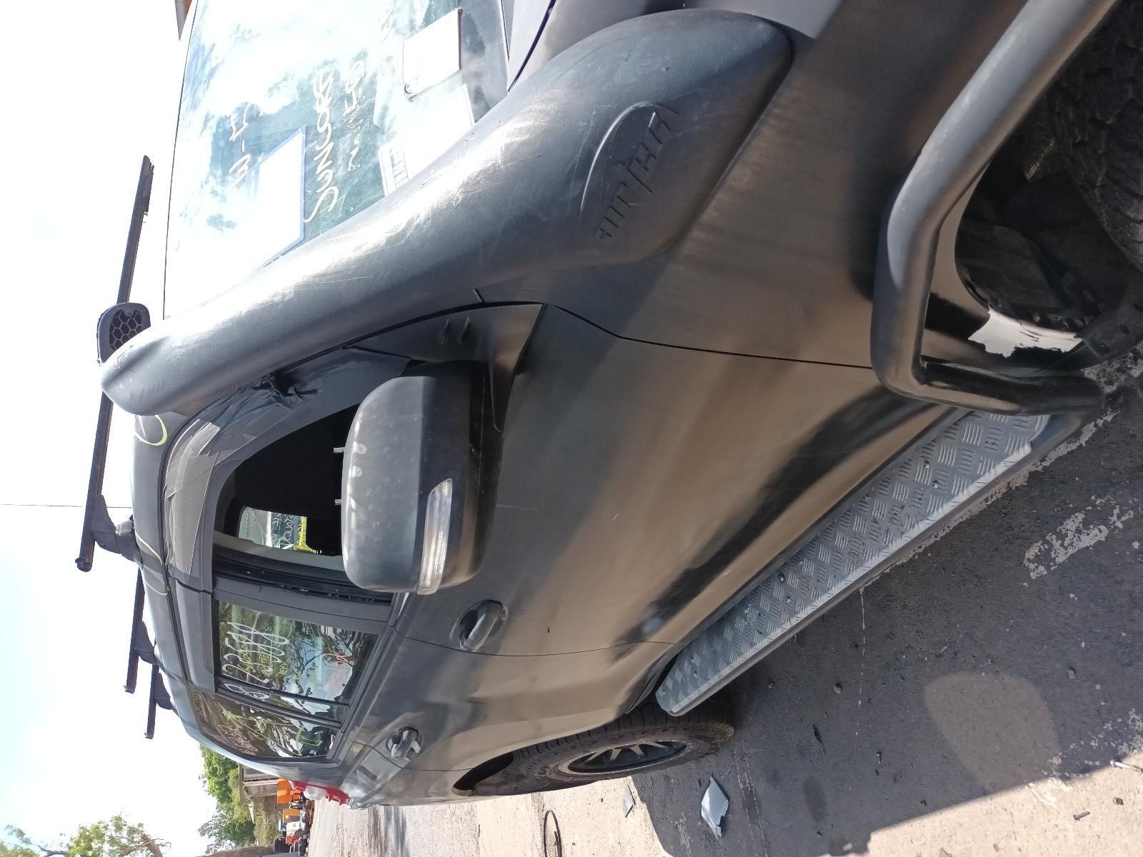 A Black Truck is Parked on the Side of the Road — South West 4WD Wreckers In Brisbane, QLD