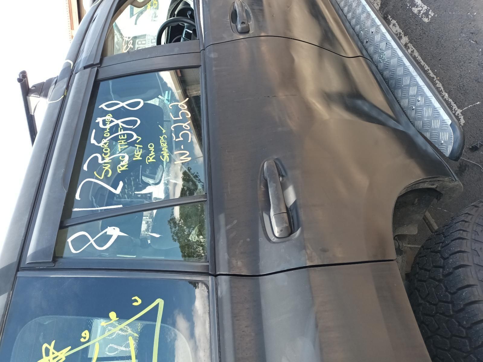 A Black Car with the Numbers Written on the Side — South West 4WD Wreckers In Brisbane, QLD