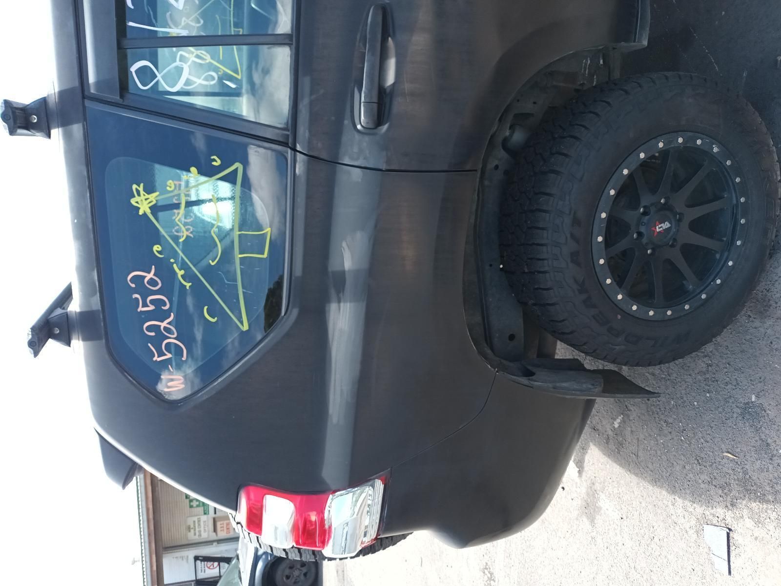 A Black SUV with a Triangle Drawn on the Back Window — South West 4WD Wreckers In Brisbane, QLD