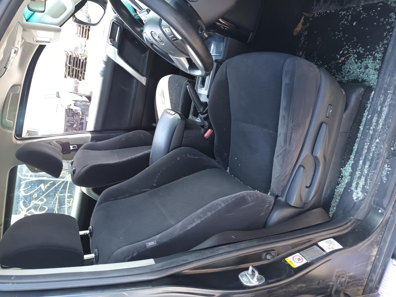 A Black Car with a Broken Window and a Steering Wheel — South West 4WD Wreckers In Brisbane, QLD