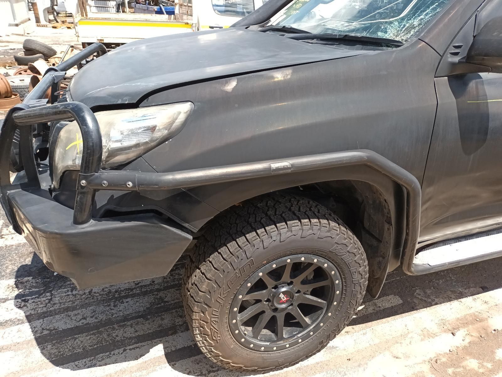 A Black Truck is Parked on the Side of the Road — South West 4WD Wreckers In Brisbane, QLD