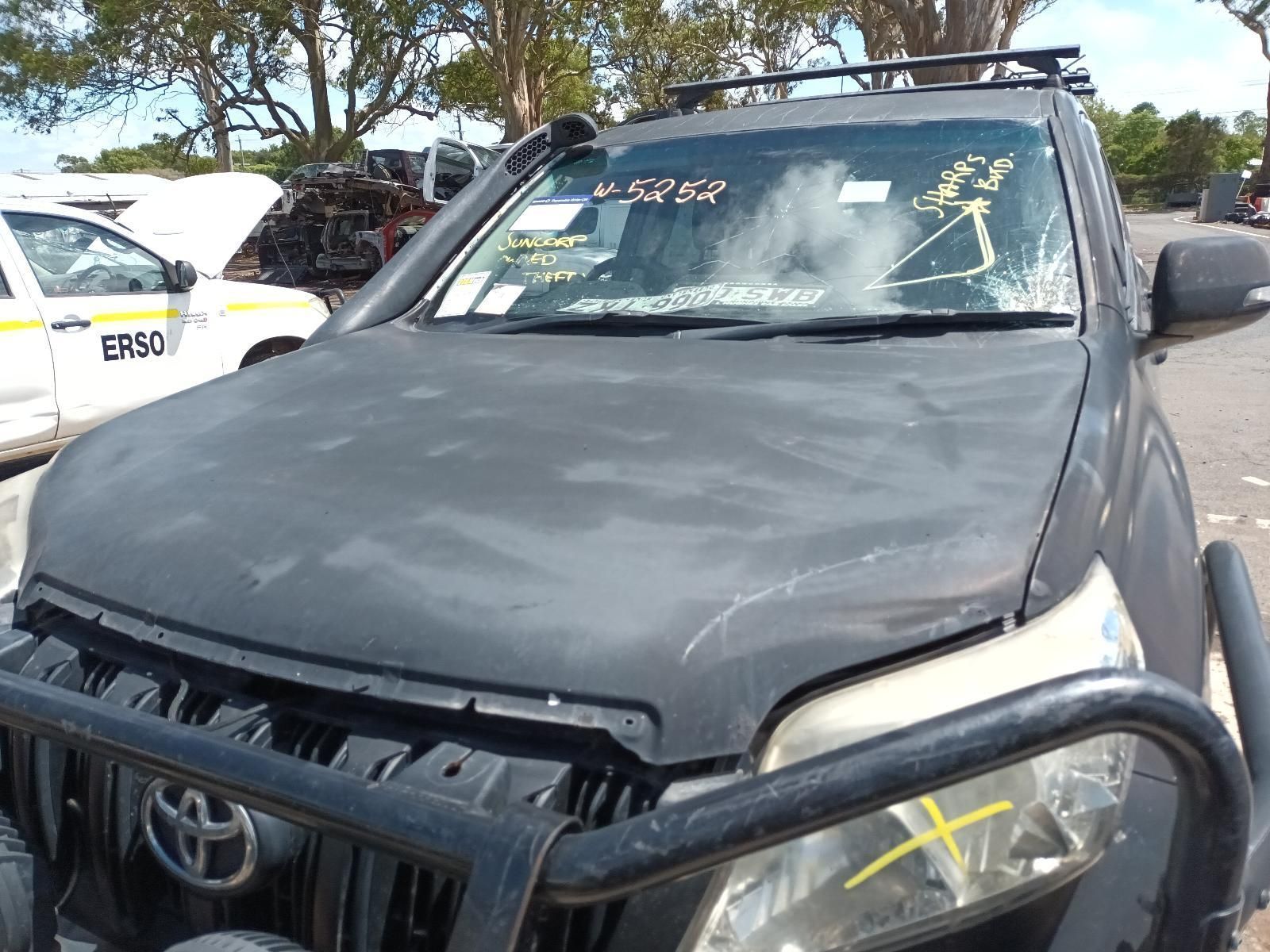 A Black Toyota Land Cruiser is Parked in a Parking Lot — South West 4WD Wreckers In Brisbane, QLD