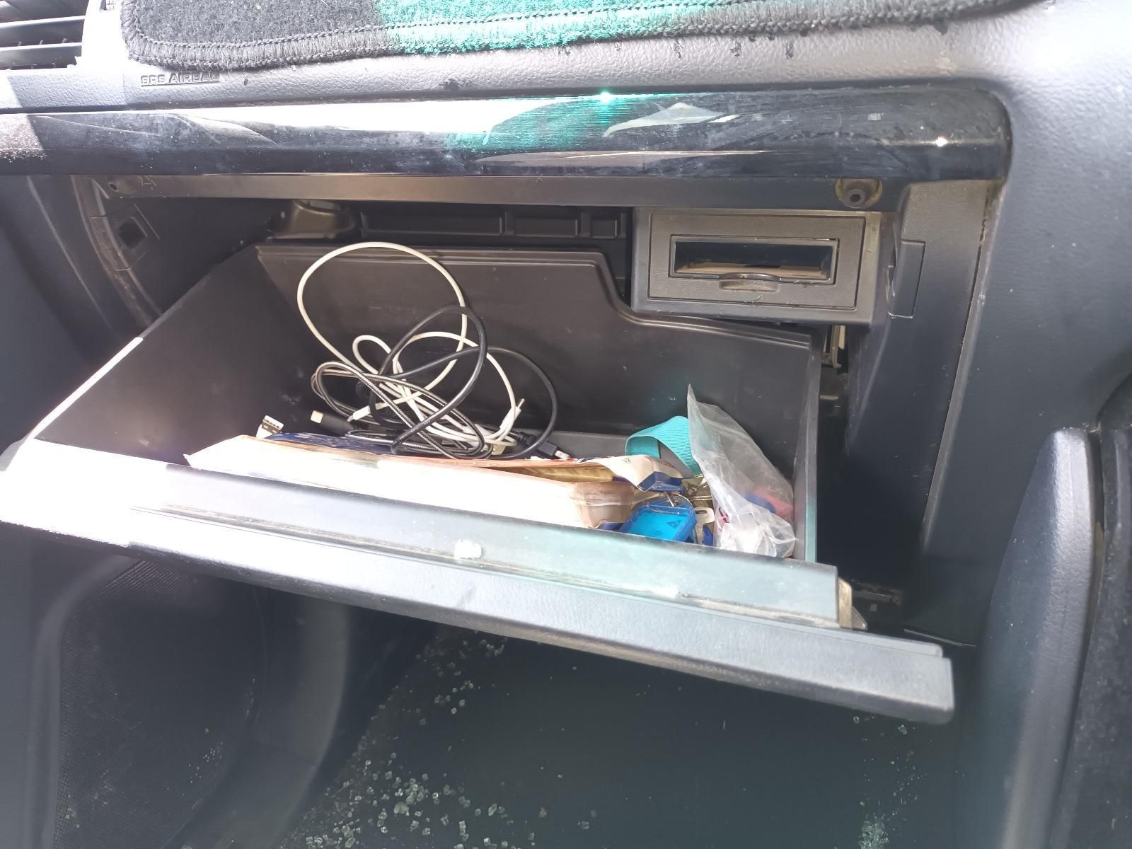 A Car Glovebox with a Lot of Items in It — South West 4WD Wreckers In Brisbane, QLD