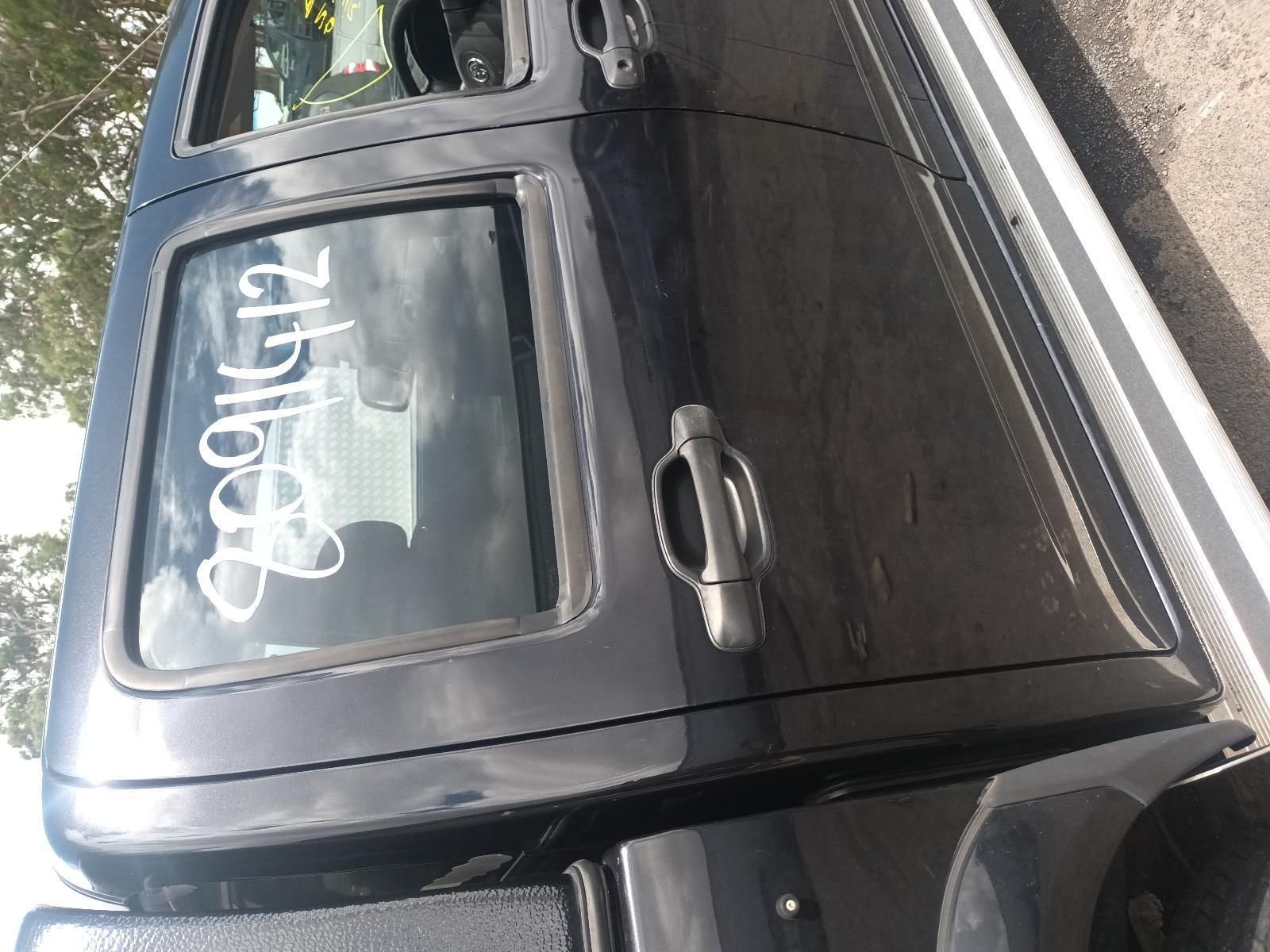 A Black Truck is Parked on the Side of the Road — South West 4WD Wreckers In Brisbane, QLD