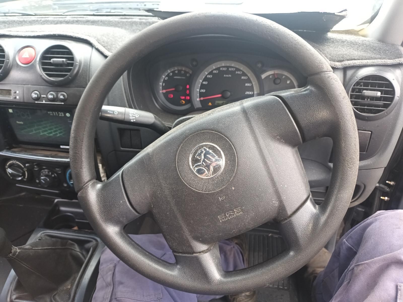 A Black Steering Wheel with a Vauxhall Logo on It — South West 4WD Wreckers In Brisbane, QLD