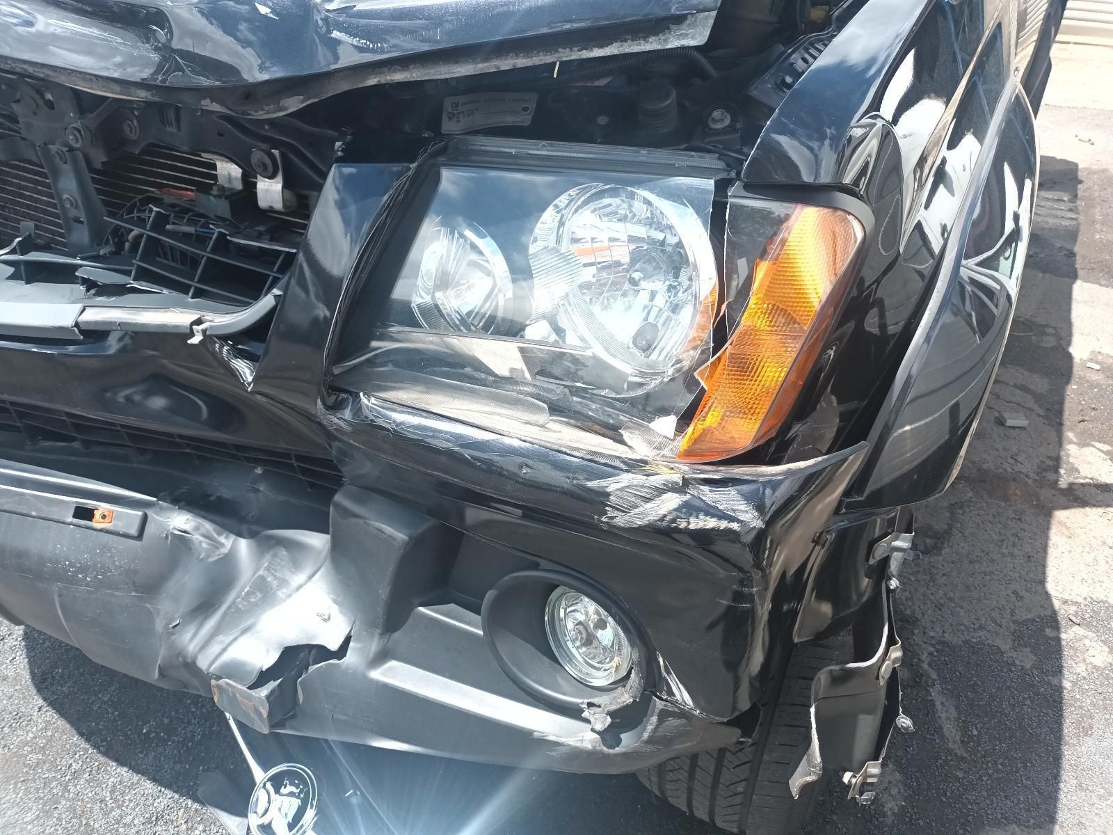 A Black Car with a Damaged Front Bumper and Headlight — South West 4WD Wreckers In Brisbane, QLD