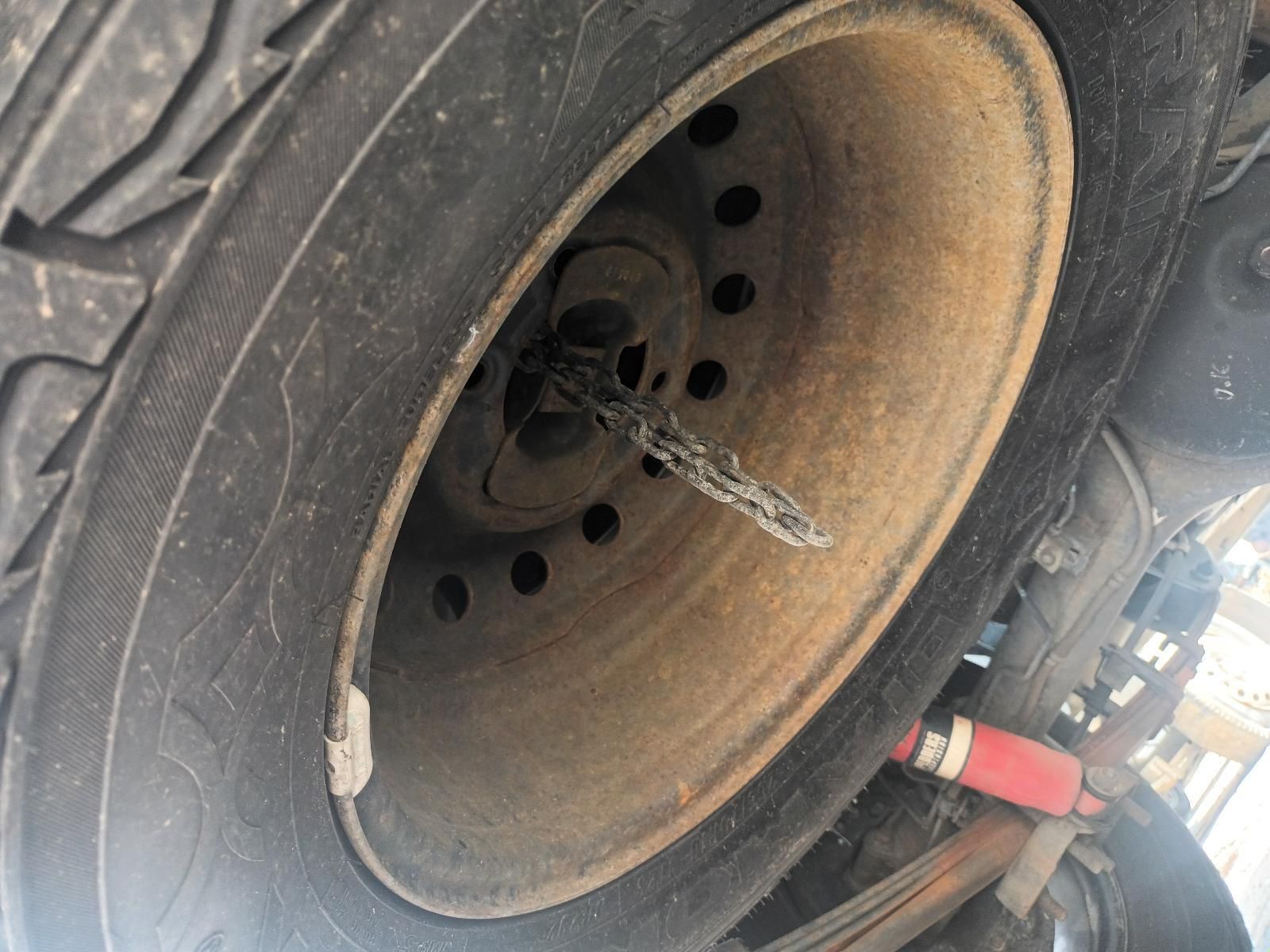 A Close Up of a Tire with a Chain Coming Out of It — South West 4WD Wreckers In Brisbane, QLD