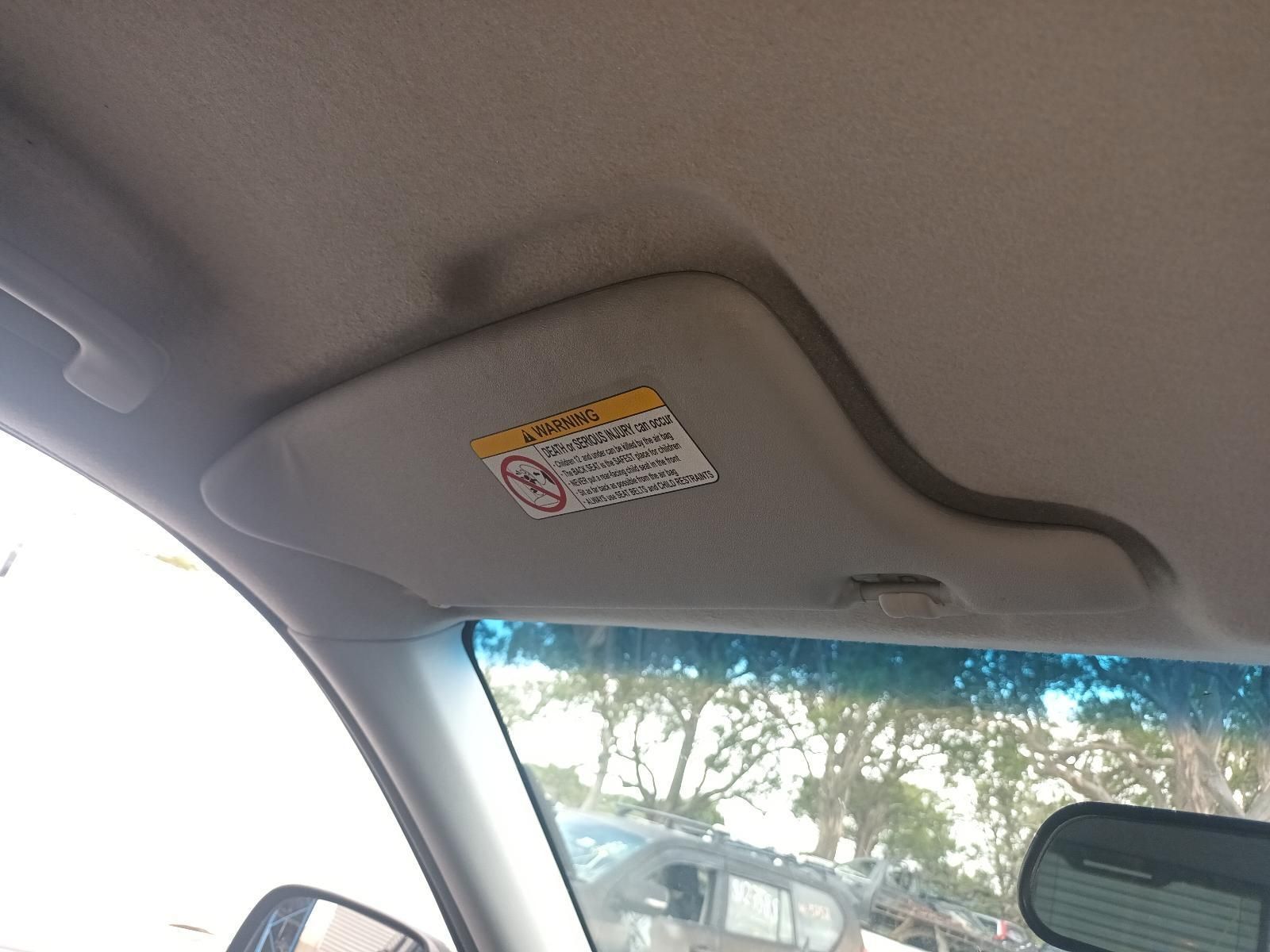A Car Sun Visor with a Warning Label on It — South West 4WD Wreckers In Brisbane, QLD