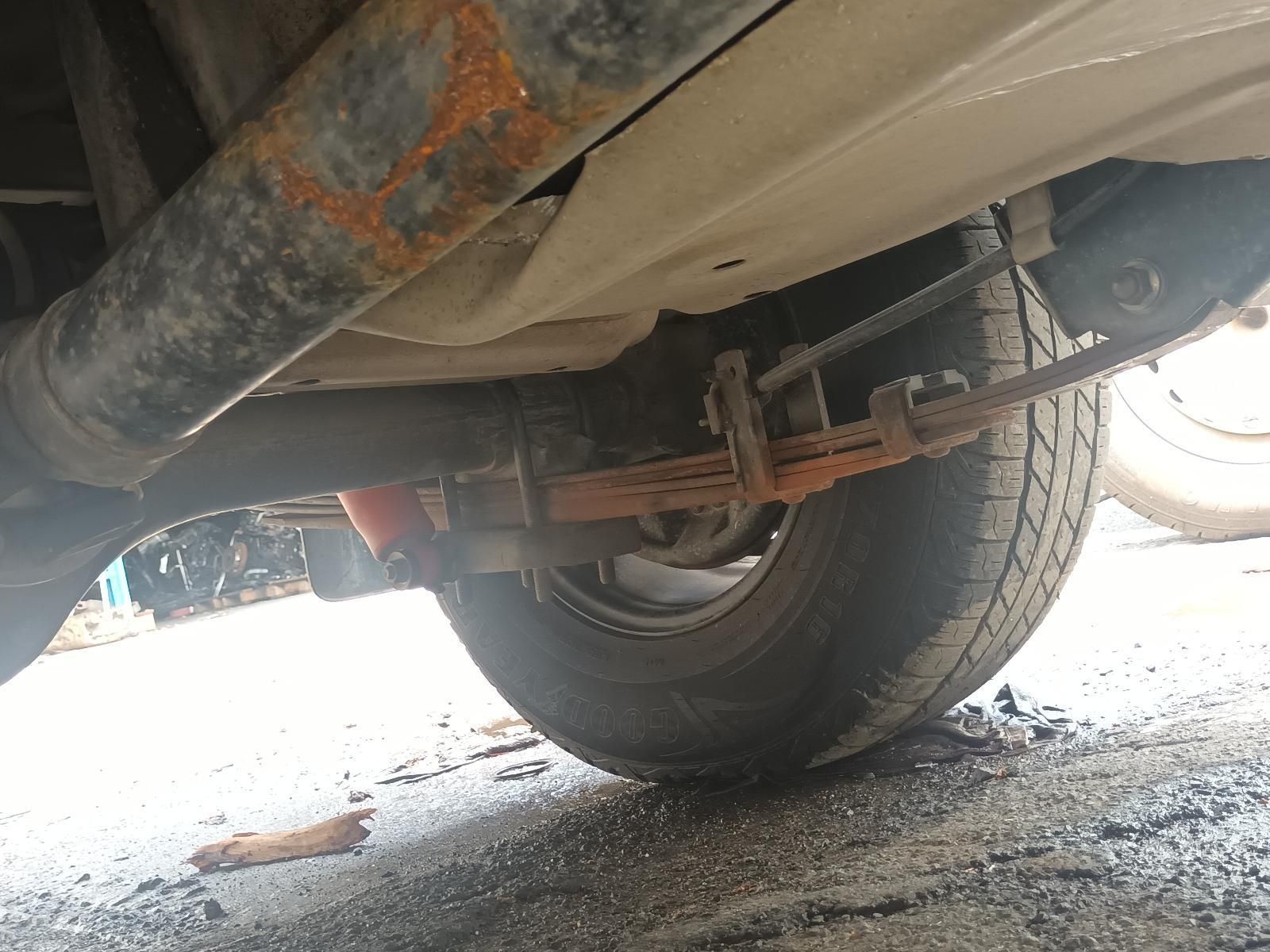 A Close Up of the Underside of a Car with a Rusty Exhaust Pipe — South West 4WD Wreckers In Brisbane, QLD