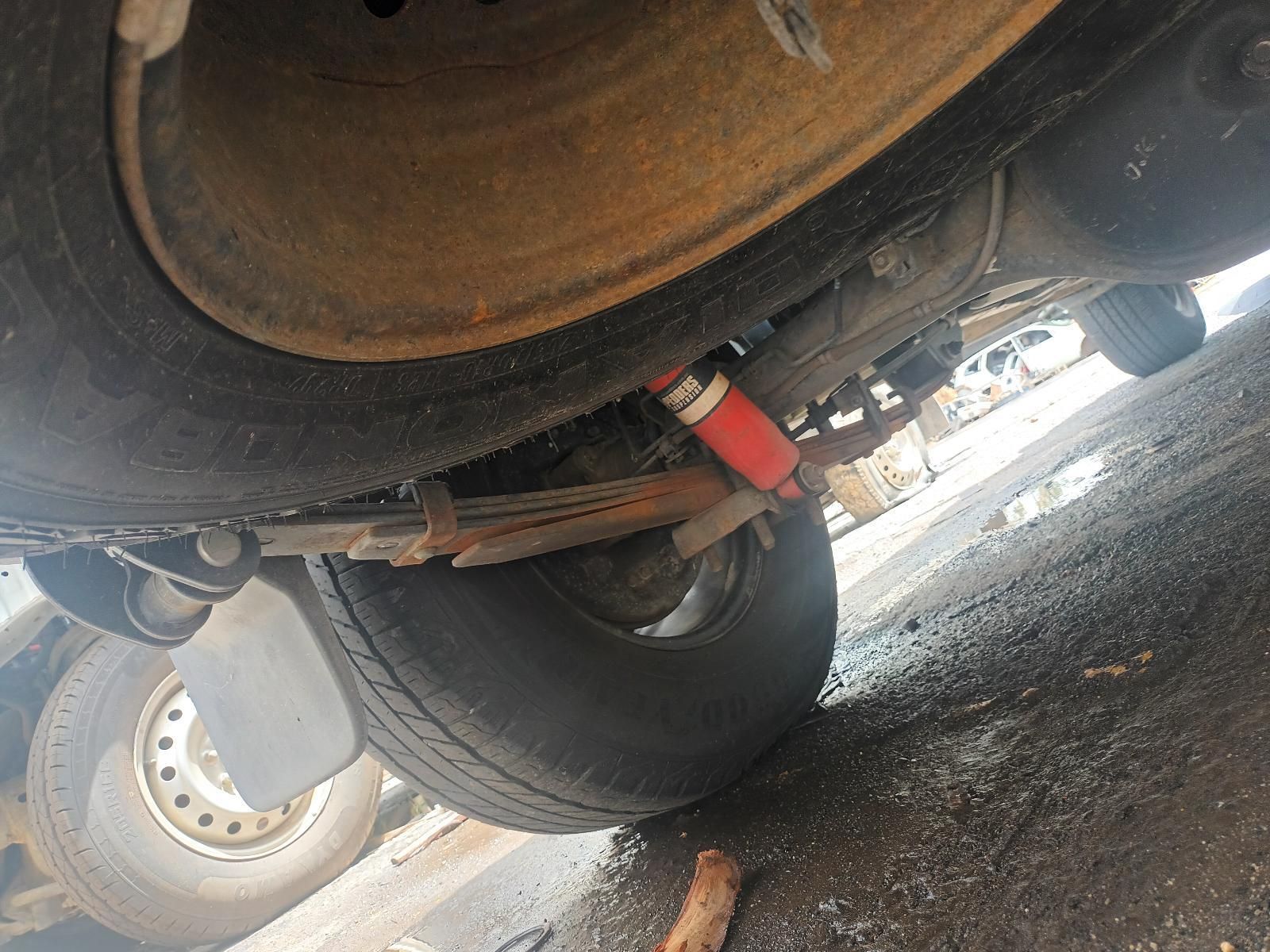A Close Up of the Underside of a Car with a Red Shock Absorber — South West 4WD Wreckers In Brisbane, QLD