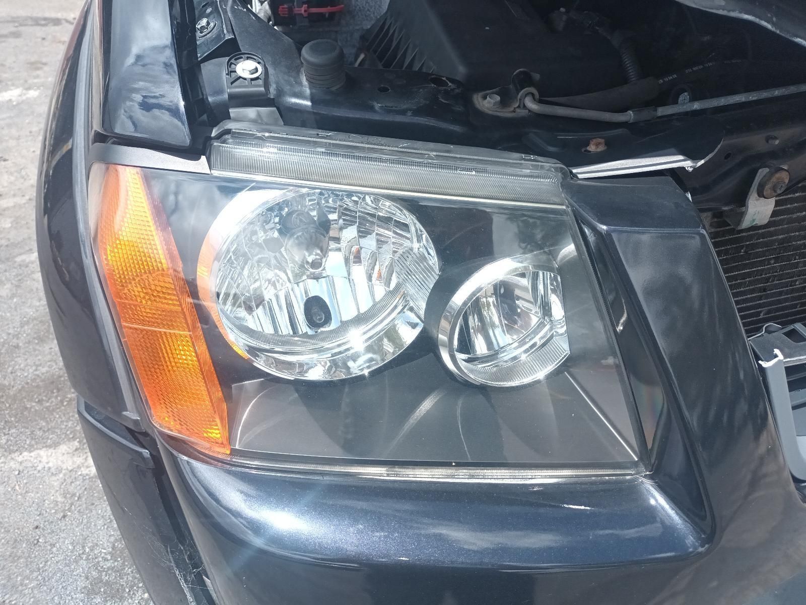 A Close Up of a Car Headlight with the Hood Open — South West 4WD Wreckers In Brisbane, QLD
