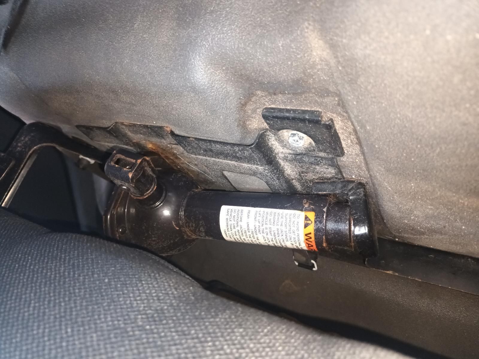 A Jack is Attached to the Side of a Car — South West 4WD Wreckers In Brisbane, QLD