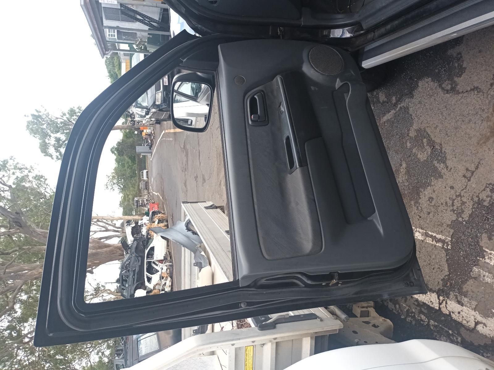 The Door of a Car is Open and Sitting on the Ground — South West 4WD Wreckers In Brisbane, QLD