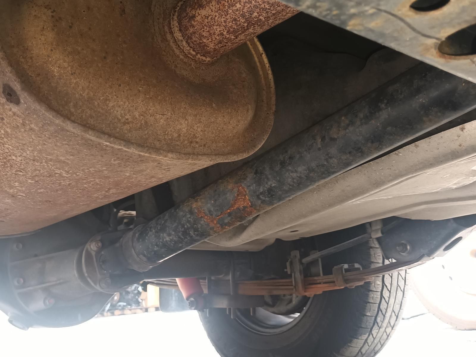 The Underside of a Car with a Rusty Exhaust Pipe — South West 4WD Wreckers In Brisbane, QLD